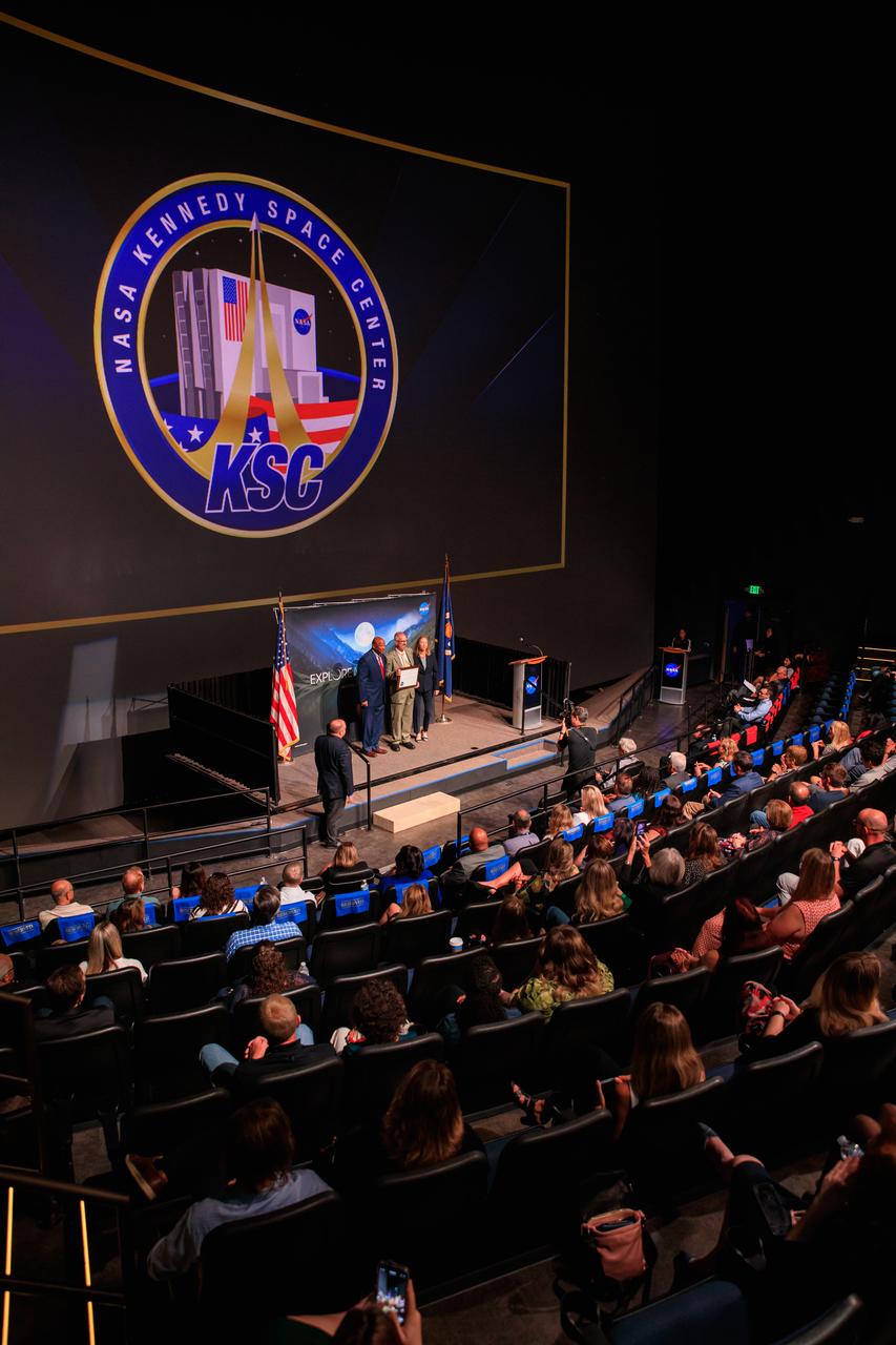 NASA’s Kennedy Space Center Director Janet Petro (right) and Deputy Director Kelvin Manning (left) present a KSC Certificate of Appreciation to Rick Goltz at the center's 2022 KSC Honor Awards Ceremony inside the IMAX Theater at the Florida spaceport’s nearby Visitor Complex on June 13, 2023. Kennedy Space Center employees, award recipients, families, and friends attended the ceremony, which honored both civil servants and contractors for their contributions to NASA and Kennedy.
