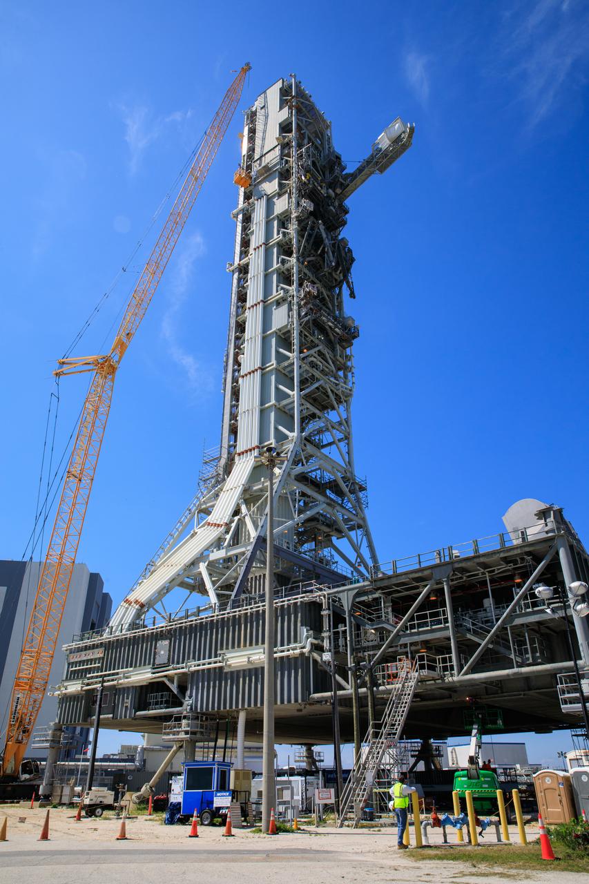 Teams with Exploration Ground Systems at NASA’s Kennedy Space Center in Florida continue to work the upgrades and repairs on mobile launcher 1 and Launch Pad 39B on June 13, 2023, ahead of the first critical ground testing for Artemis II.  The crew access arm (CAA) has been extended in this view of the mobile launcher. The CAA is the entry and exit point astronauts will use for access to the Orion spacecraft. Tests will be conducted to ensure the arm and supporting mobile launcher systems are certified to support crewed missions. Artemis II will be the first Artemis mission flying crew aboard Orion. 