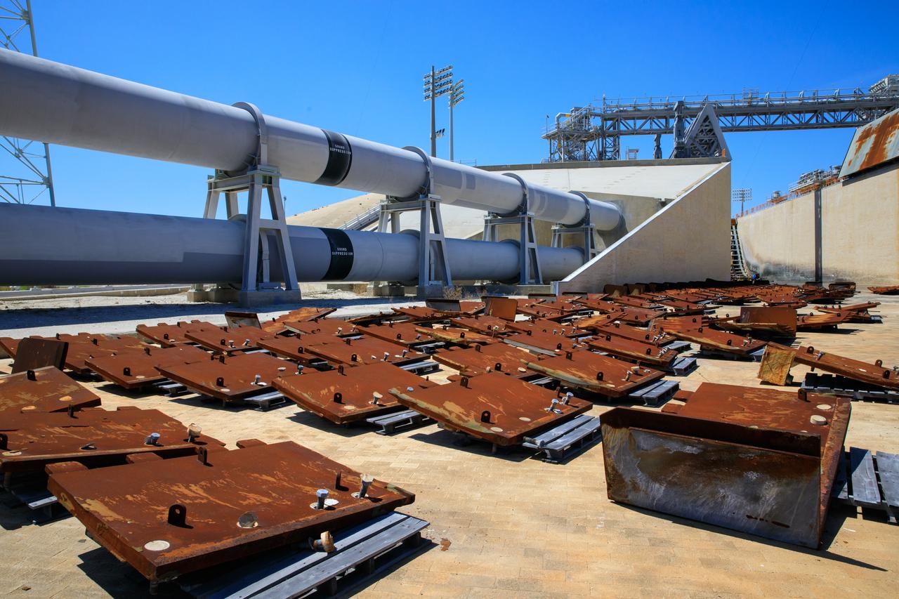Teams with Exploration Ground Systems at NASA’s Kennedy Space Center in Florida continue to work the upgrades and repairs on mobile launcher 1 and Launch Pad 39B on June 13, 2023, ahead of the first critical ground testing for Artemis II. Teams are re-designing the panels on the flame deflector in the flame trench that withstood damage observed after launch of Artemis I. Artemis II will be the first Artemis mission flying crew aboard Orion. 