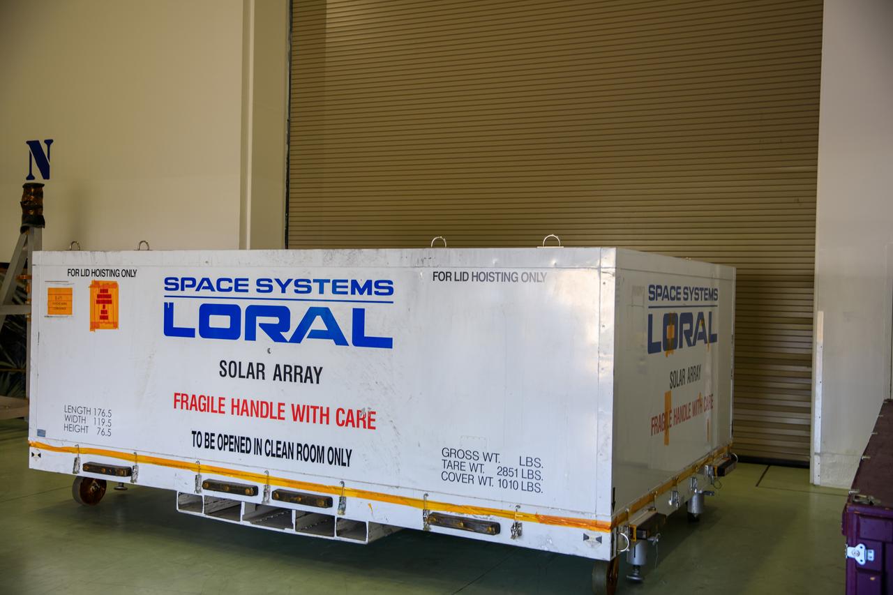 The transport carrier containing the twin solar arrays for NASA’s Psyche spacecraft is secured inside the Astrotech Space Operations Facility near the agency’s Kennedy Space Center in Florida on July 15, 2023. The solar arrays were shipped from Maxar Technologies, in San Jose, California. They are part of the solar electric propulsion system, provided by Maxar, that will power the spacecraft on its journey to explore a metal-rich asteroid. Psyche will launch atop a SpaceX Falcon Heavy rocket from Launch Complex 39A at Kennedy. Launch is targeted for Oct. 5, 2023. Riding with Psyche is a pioneering technology demonstration, NASA’s Deep Space Optical Communications (DSOC) experiment. 