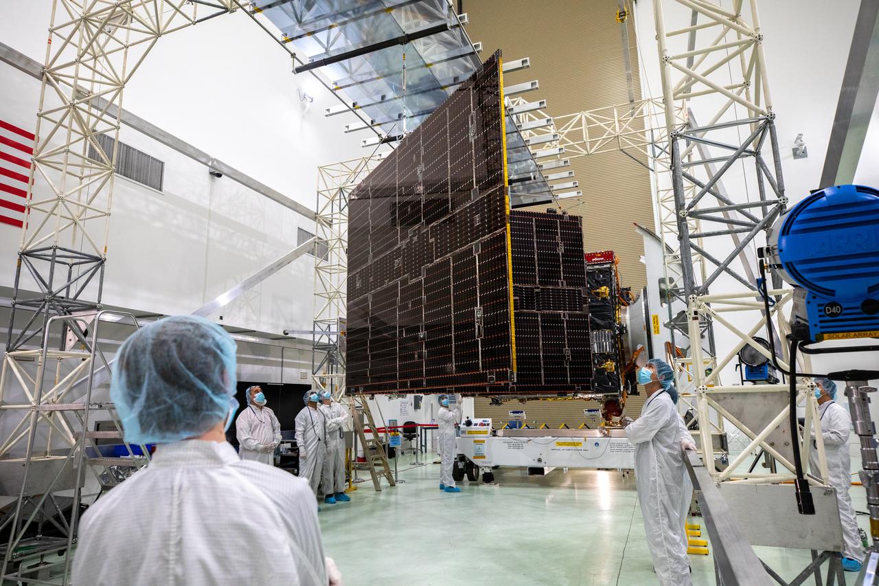 Team members begin to retract the second of two solar arrays attached to NASA’s Psyche spacecraft inside the Astrotech Space Operations Facility near the agency’s Kennedy Space Center in Florida on July 25, 2023. The solar arrays, which were shipped from Maxar Technologies, in San Jose, California, are being stowed for launch. They are part of the solar electric propulsion system, provided by Maxar, that will power the spacecraft on its journey to explore a metal-rich asteroid. Psyche will launch atop a SpaceX Falcon Heavy rocket from Launch Complex 39A at Kennedy. Launch is targeted for Oct. 5, 2023. Riding with Psyche is a pioneering technology demonstration, NASA’s Deep Space Optical Communications (DSOC) experiment.