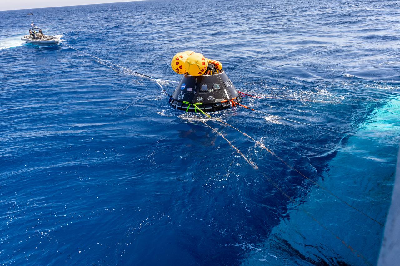 The Crew Module Test Article (CMTA) is seen in the waters of the Pacific Ocean during NASA’s Underway Recovery Test 10 (URT-10). The CMTA is a full-scale mockup of the Orion spacecraft and is used by NASA and its Department of Defense partners to practice recovery procedures for crewed Artemis missions. URT-10 is the first test specifically in support of the Artemis II mission and allowed the team to practice what it will be like to recover astronauts and get them back to the recovery ship safely. 