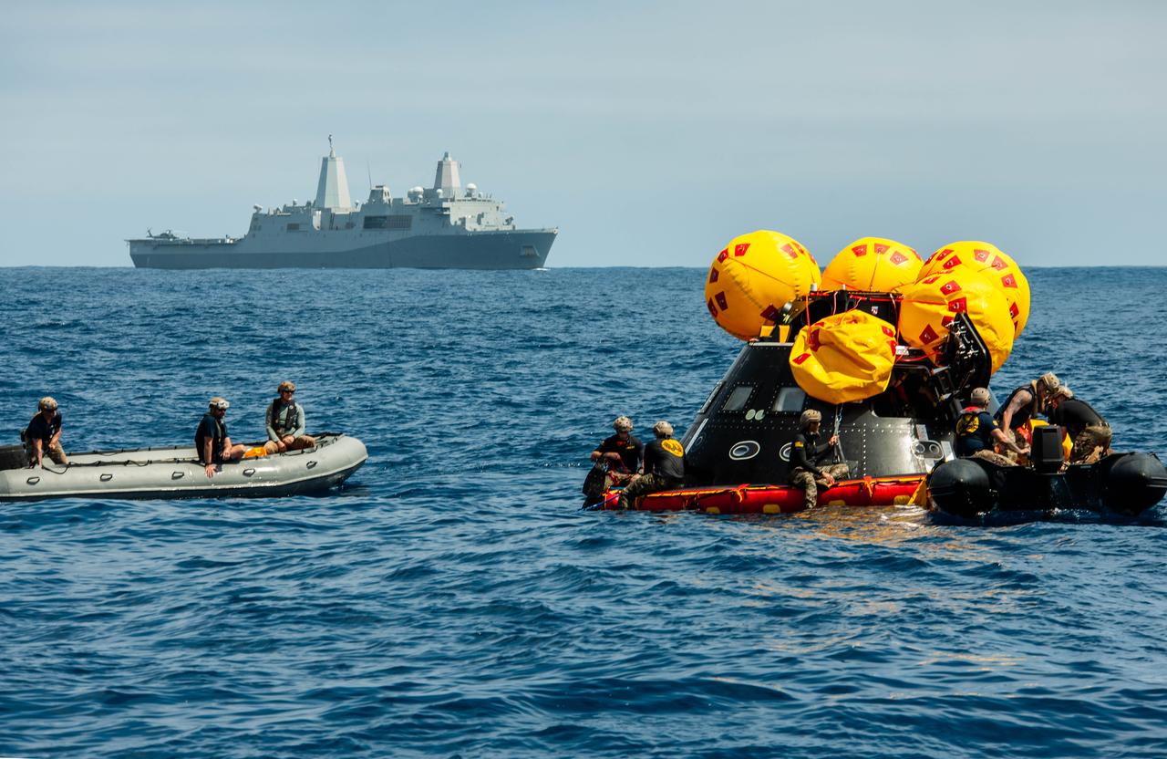 Navy divers from Explosive Ordnance Disposal (EOD) Expeditionary Support Unit 1 work to secure the Orion Crew Module Test Article (CMTA) in the Pacific Ocean as part of NASA’s Underway Recovery Test 10 (URT-10). The divers are trained in open water and small boat procedures and will be the team to help Artemis astronauts exit the Orion spacecraft and make it safely to the recovery ship after splashdown in addition to preparing the spacecraft to be transported back inside the recovery ship. 