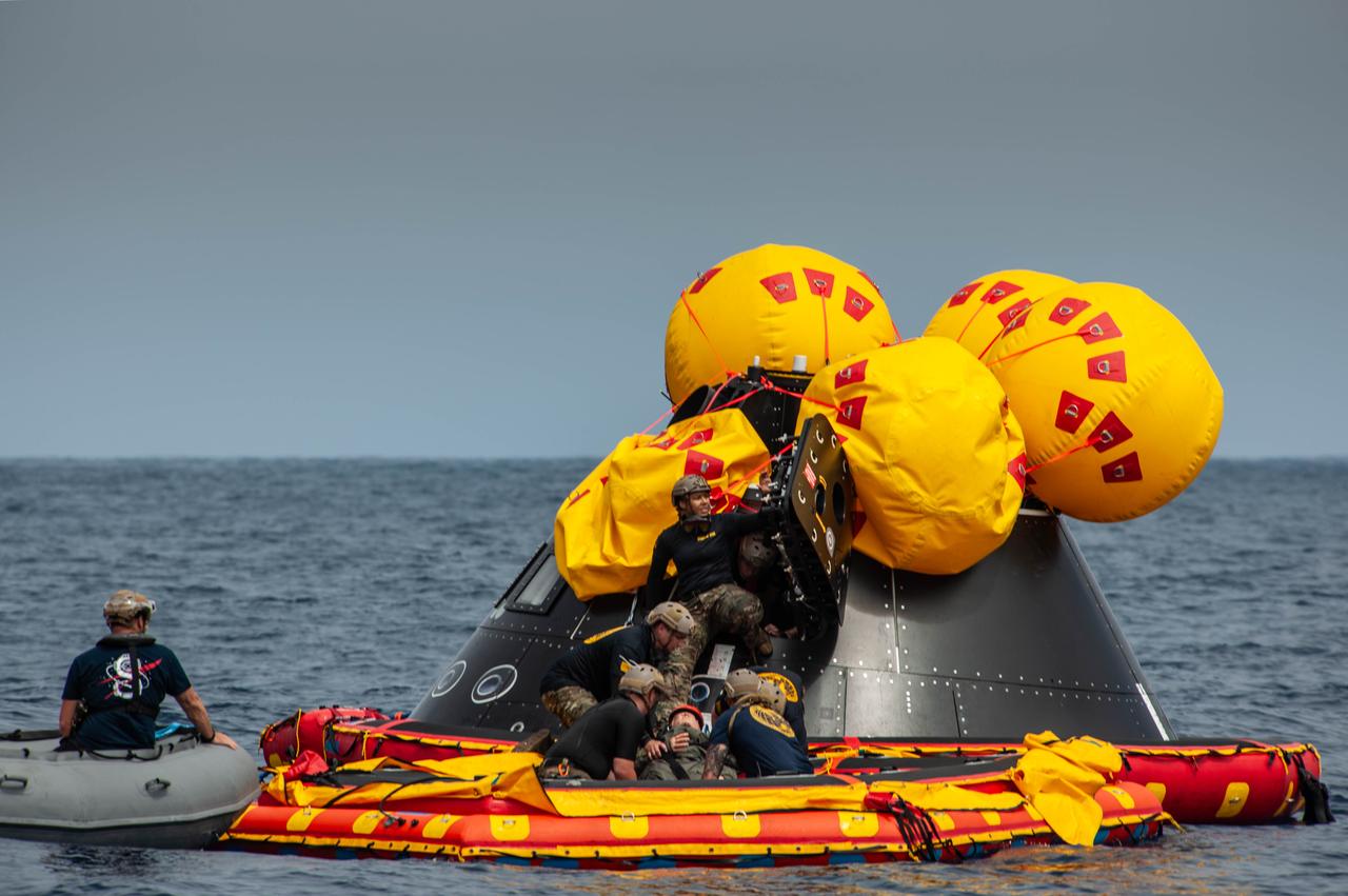 Navy divers from Explosive Ordnance Disposal (EOD) Expeditionary Support Unit 1 practice contingency recovery procedures with a manikin and the Orion Crew Module Test Article (CMTA) in the Pacific Ocean as part of NASA’s Underway Recovery Test 10 (URT-10). The divers are trained in open water and small boat procedures and will be the team to help Artemis astronauts exit the Orion spacecraft and make it safely to the recovery ship after splashdown in addition to preparing the spacecraft to be transported back inside the recovery ship. 