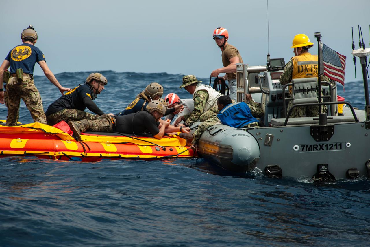 Navy divers from Explosive Ordnance Disposal (EOD) Expeditionary Support Unit 1 work to secure the Orion Crew Module Test Article (CMTA) in the Pacific Ocean as part of NASA’s Underway Recovery Test 10 (URT-10). The divers are trained in open water and small boat procedures and will be the team to help Artemis astronauts exit the Orion spacecraft and make it safely to the recovery ship after splashdown in addition to preparing the spacecraft to be transported back inside the recovery ship. 