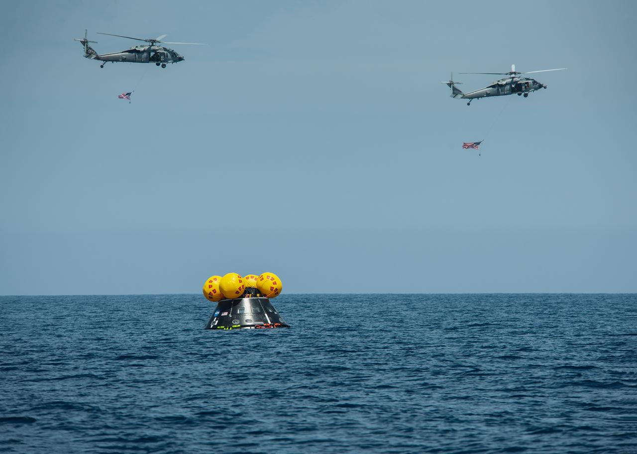 The Crew Module Test Article (CMTA) is seen in the waters of the Pacific Ocean during NASA’s Underway Recovery Test 10 (URT-10). The CMTA is a full-scale mockup of the Orion spacecraft and is used by NASA and its Department of Defense partners to practice recovery procedures for crewed Artemis missions. URT-10 is the first test specifically in support of the Artemis II mission and allowed the team to practice what it will be like to recover astronauts and get them back to the recovery ship safely. In this photo, Navy divers from Explosive Ordnance Disposal (EOD) Expeditionary Support Unit 1 secure the CMTA and prepare it to be recovered back inside USS John P. Murtha.
