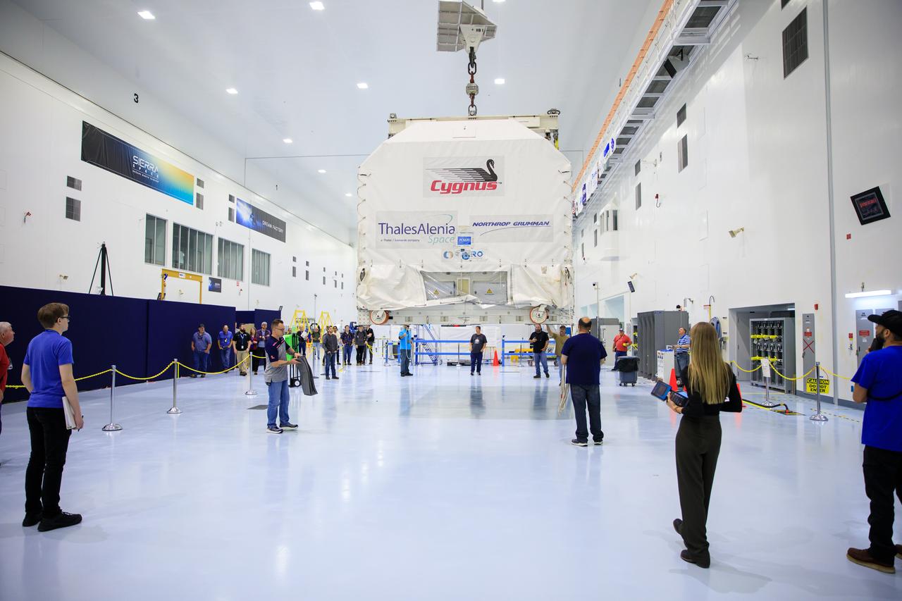 The Northrop Grumman Cygnus spacecraft’s pressurized cargo module (PCM) for the company’s 20th commercial resupply mission is lifted and moved by crane in its environmentally controlled shipping container inside the high bay in the Space Station Processing Facility at NASA's Kennedy Space Center in Florida on Aug. 2, 2023. Cygnus will launch later this year atop a SpaceX Falcon 9 rocket from Cape Canaveral Space Force Station’s Space Launch Complex 40 to the International Space Station. Cygnus will undergo prelaunch processing at Kennedy before it is transported to SpaceX’s integration facility.