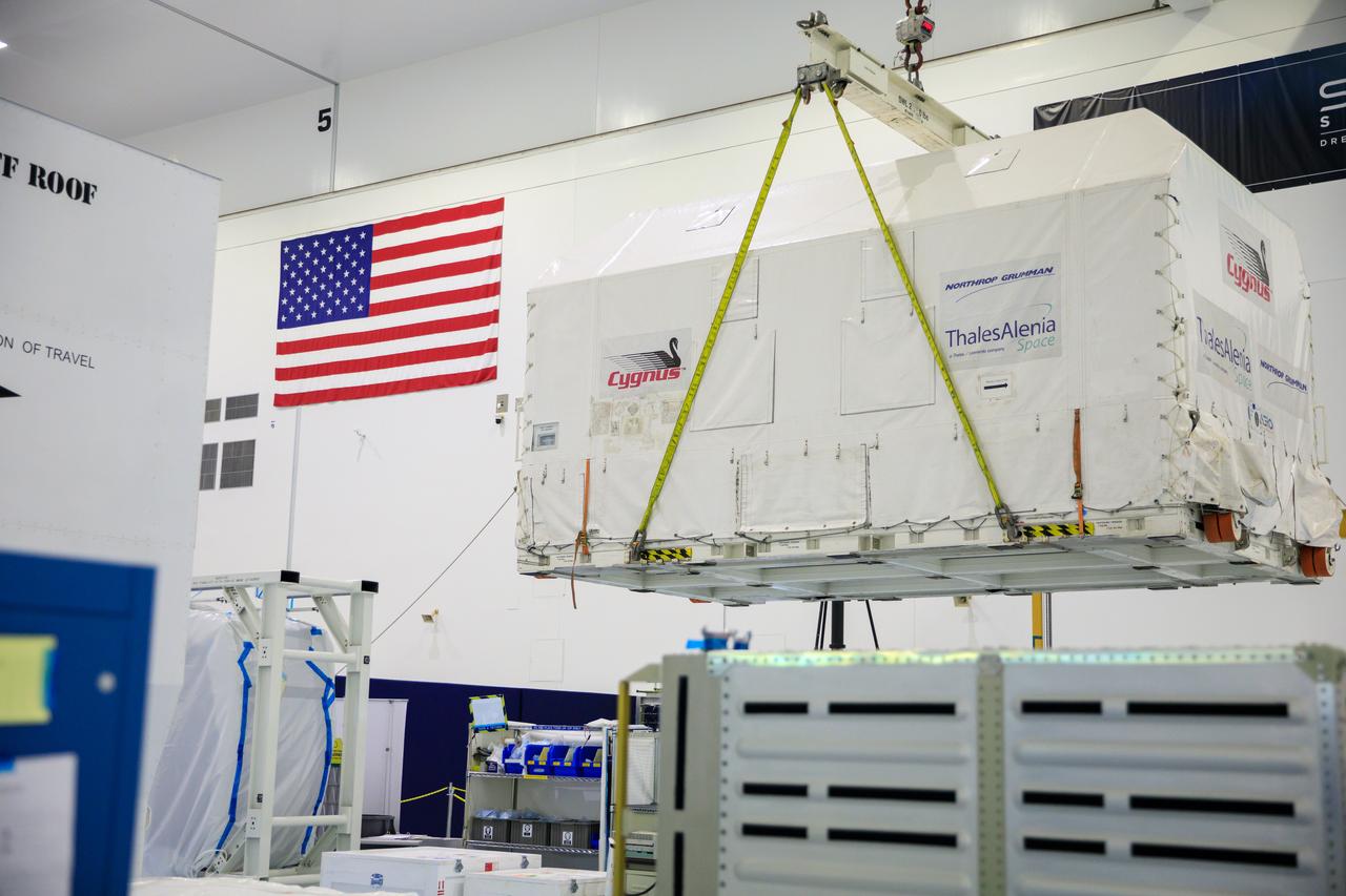 The Northrop Grumman Cygnus spacecraft’s pressurized cargo module (PCM) for the company’s 20th commercial resupply mission is moved by crane in its environmentally controlled shipping container in to the Space Station Processing Facility’s high bay at NASA's Kennedy Space Center in Florida on Aug. 2, 2023. Cygnus will launch later this year atop a SpaceX Falcon 9 rocket from Cape Canaveral Space Force Station’s Space Launch Complex 40 to the International Space Station. Cygnus will undergo prelaunch processing at Kennedy before it is transported to SpaceX’s integration facility.