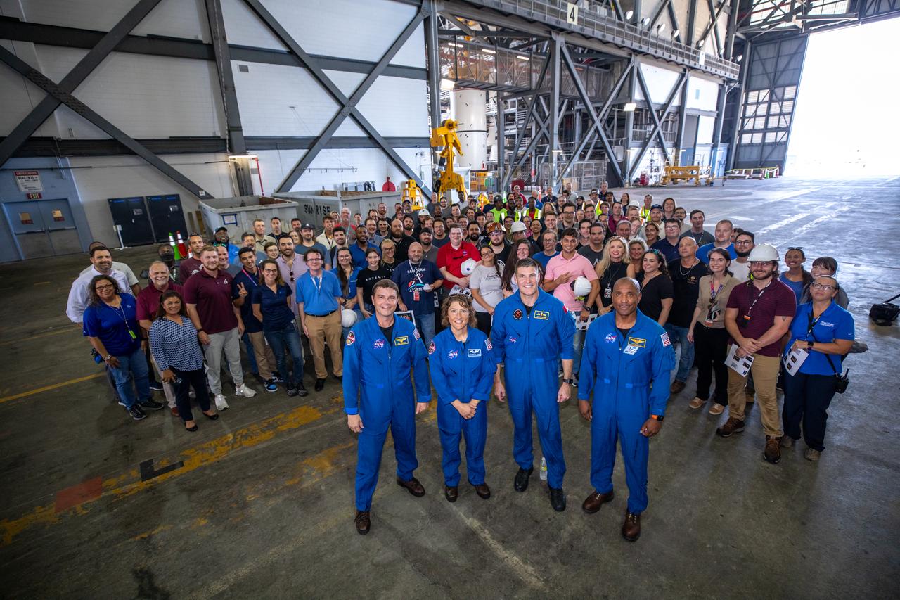 Artemis II astronauts visit NASA’s Kennedy Space Center in Florida on Aug. 7, 2023. In front, from left, are NASA astronauts Reid Wiseman and Christina Koch, CSA (Canadian Space Agency) astronaut Jeremy Hansen, and NASA astronaut Victor Glover in the transfer aisle of the Vehicle Assembly Building. Behind them are Exploration Ground Systems team members. The approximately 10-day Artemis II flight will test NASA’s foundational human deep space exploration capabilities, the Space Launch System rocket and Orion spacecraft, for the first time with astronauts and will pave the way for lunar surface missions, including landing the first woman and the first person of color on the Moon. 