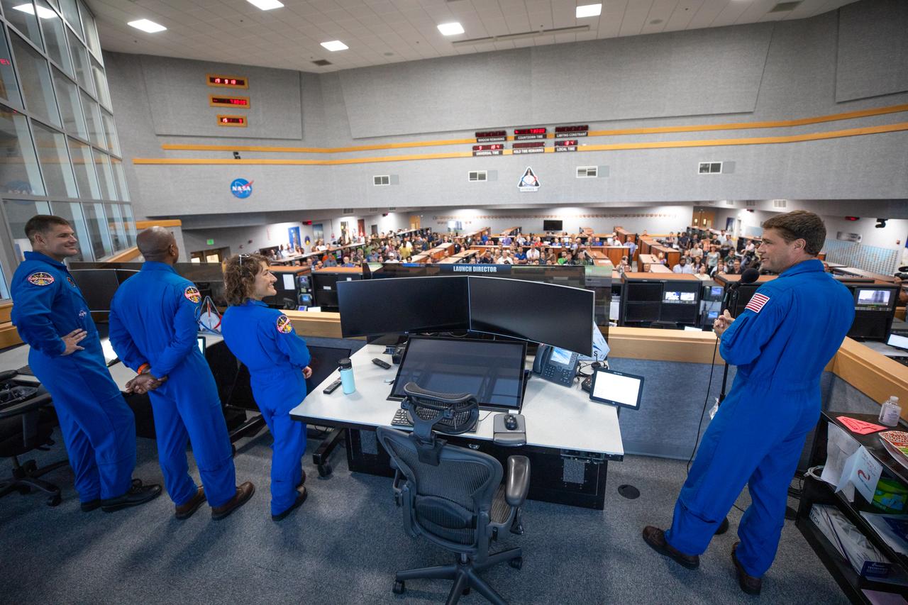 Artemis II astronauts visit the Artemis launch team inside Firing Room 1 in the Launch Control Center at NASA’s Kennedy Space Center in Florida on Aug. 7, 2023. In front, from left are CSA (Canadian Space Agency) astronaut Jeremy Hansen, and NASA astronauts Victor Glover, Christina Koch, and Reid Wiseman. The approximately 10-day Artemis II flight will test NASA’s foundational human deep space exploration capabilities, the Space Launch System rocket and Orion spacecraft, for the first time with astronauts and will pave the way for lunar surface missions, including landing the first woman and the first person of color on the Moon. 