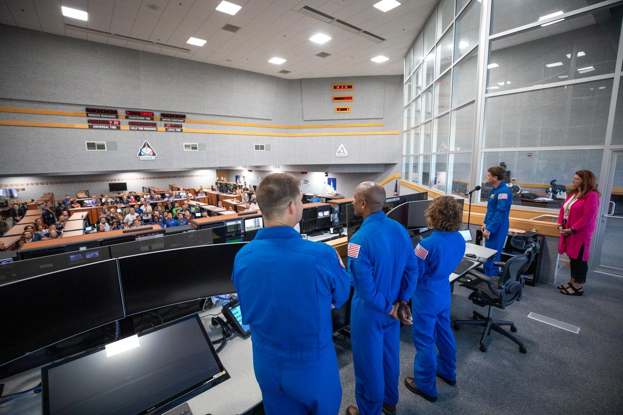 Artemis II astronauts visit the Artemis launch team inside Firing Room 1 in the Launch Control Center at NASA’s Kennedy Space Center in Florida on Aug. 7, 2023. In front, from left are CSA (Canadian Space Agency) astronaut Jeremy Hansen, and NASA astronauts Victor Glover, Christina Koch, and Reid Wiseman. At far right is Artemis Launch Director Charlie Blackwell-Thompson. The approximately 10-day Artemis II flight will test NASA’s foundational human deep space exploration capabilities, the Space Launch System rocket and Orion spacecraft, for the first time with astronauts and will pave the way for lunar surface missions, including landing the first woman and the first person of color on the Moon.
