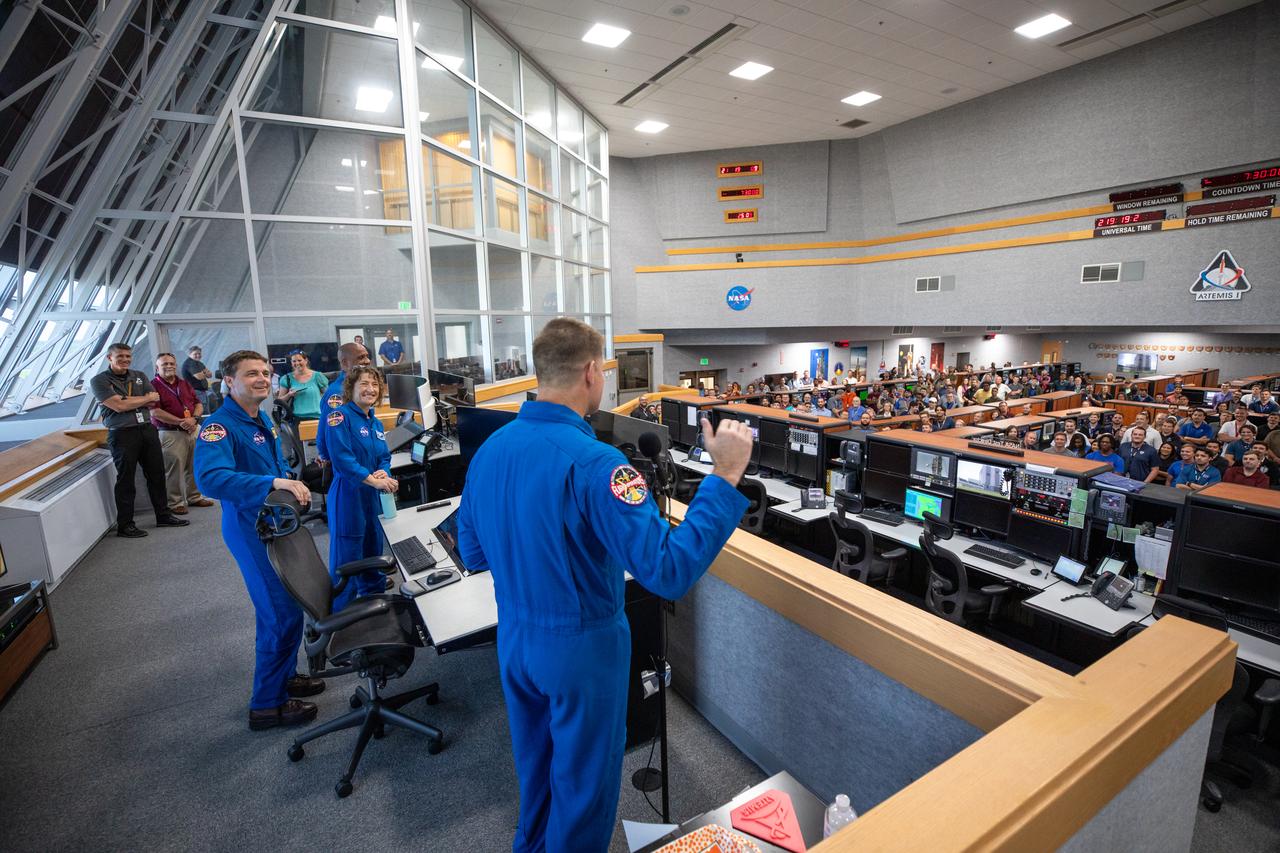 Artemis II astronauts visit the Artemis launch team inside Firing Room 1 in the Launch Control Center at NASA’s Kennedy Space Center in Florida on Aug. 7, 2023. In front, from left are NASA astronauts Victor Glover (partially hidden), Christina Koch, and Reid Wiseman, and CSA (Canadian Space Agency) astronaut Jeremy Hansen. The approximately 10-day Artemis II flight will test NASA’s foundational human deep space exploration capabilities, the Space Launch System rocket and Orion spacecraft, for the first time with astronauts and will pave the way for lunar surface missions, including landing the first woman and the first person of color on the Moon. 
