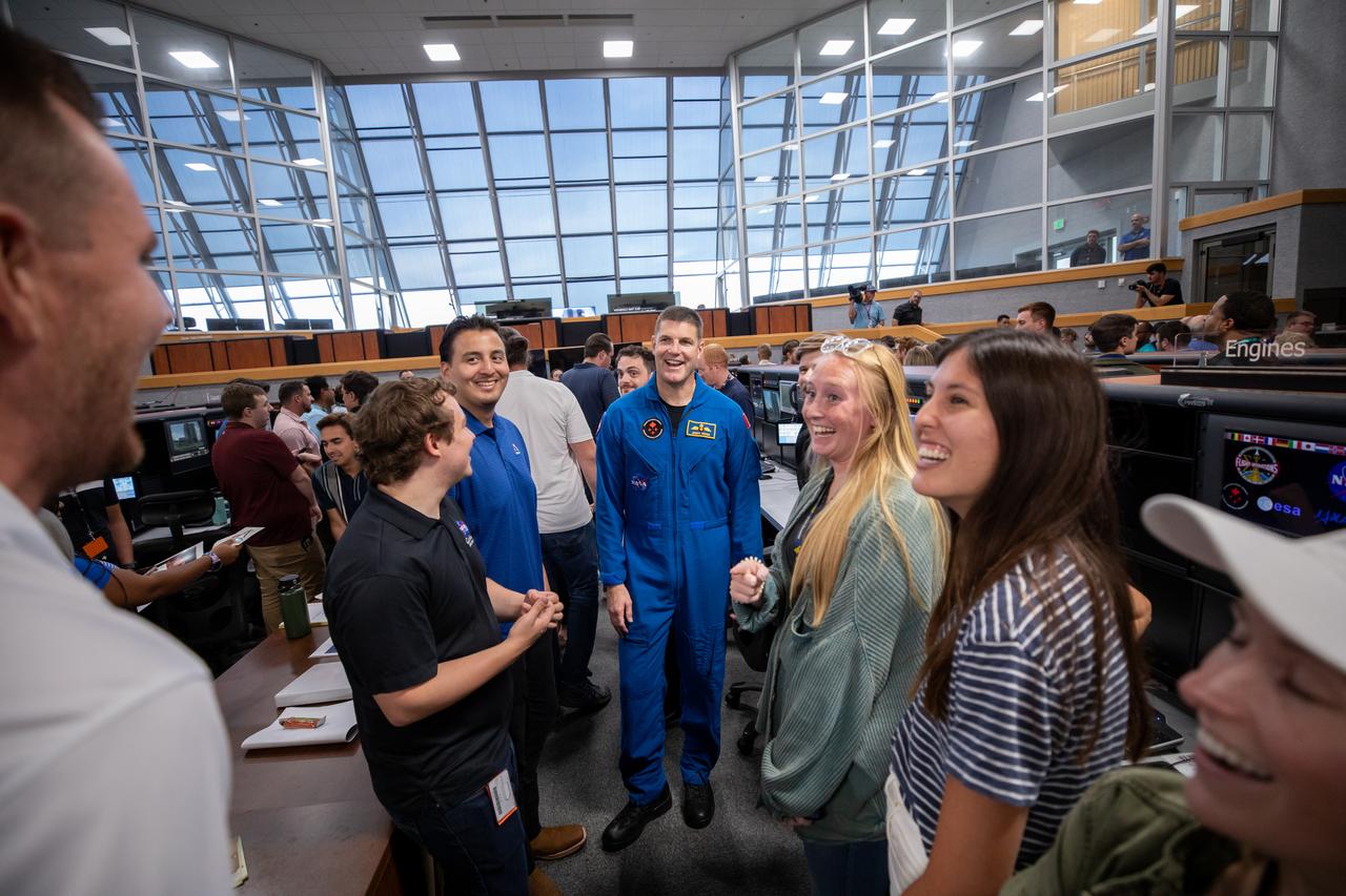 Artemis II NASA astronauts were at the agency’s Kennedy Space Center in Florida on Aug. 7, 2023. CSA (Canadian Space Agency) astronaut Jeremy Hansen talks with members of the Artemis launch team inside Firing Room 1 of the Launch Control Center. Hansen and fellow Artemis II astronauts Victor Glover, Christina Koch, and Reid Wiseman are at the center to meet workers and tour facilities. The approximately 10-day Artemis II flight will test NASA’s foundational human deep space exploration capabilities, the Space Launch System rocket and Orion spacecraft, for the first time with astronauts and will pave the way for lunar surface missions, including landing the first woman and the first person of color on the Moon. 