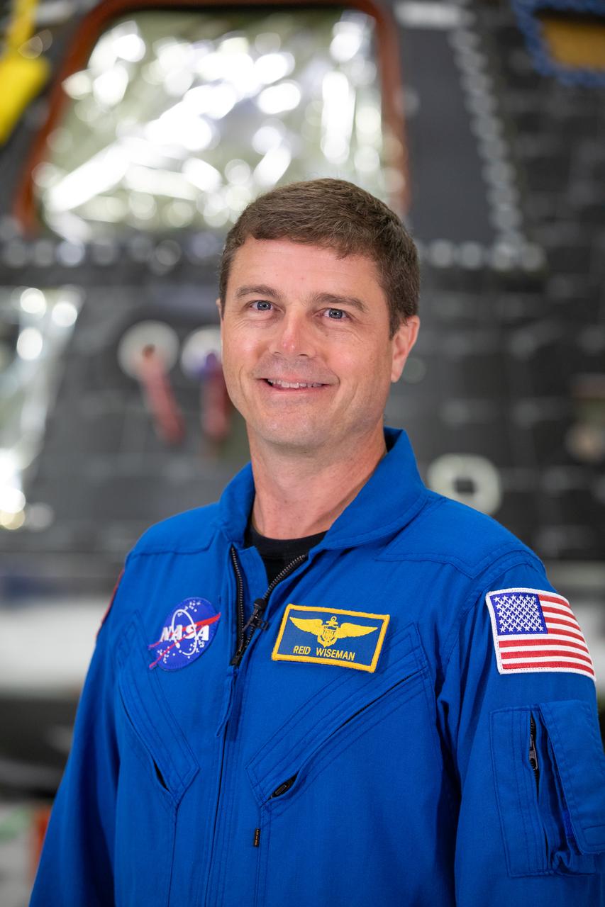Artemis II mission commander Reid Wiseman poses inside the Neil Armstrong Operations and Checkout Building at NASA’s Kennedy Space Center in Florida on Aug. 8, 2023. The Artemis II Orion crew module is undergoing acoustic testing ahead of integration with the European Service Module. Artemis II is the first crewed mission on NASA’s path to establishing a long-term lunar presence for science and exploration under Artemis.