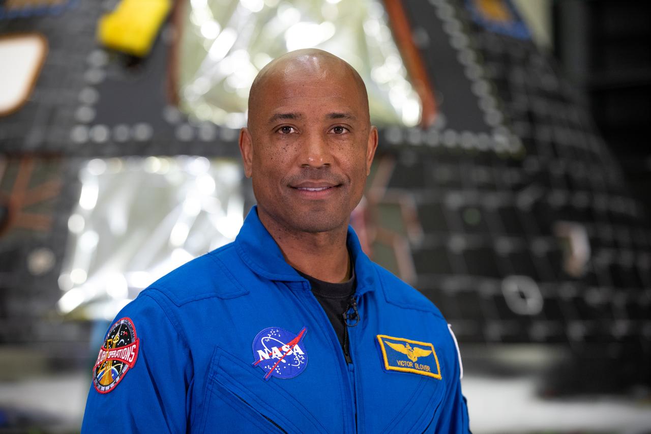 Artemis II pilot Victor Glover poses inside the Neil Armstrong Operations and Checkout Building at NASA’s Kennedy Space Center in Florida on Aug. 8, 2023. The Artemis II Orion crew module is undergoing acoustic testing ahead of integration with the European Service Module. Artemis II is the first crewed mission on NASA’s path to establishing a long-term lunar presence for science and exploration under Artemis.