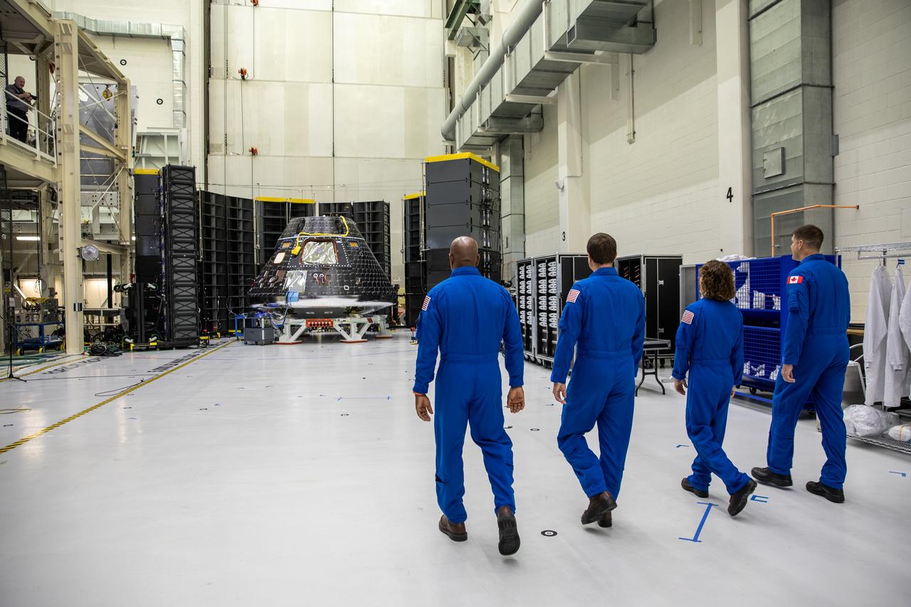 Artemis II crew members, shown inside the Neil Armstrong Operations and Checkout Building at NASA’s Kennedy Space Center in Florida, walk toward their Orion crew module on Aug. 8, 2023. From left are: Victor Glover, pilot; Reid Wiseman, commander; Christina Hammock Koch, mission specialist; and Jeremy Hansen, mission specialist. The crew module is undergoing acoustic testing ahead of integration with the European Service Module. Artemis II is the first crewed mission on NASA’s path to establishing a long-term lunar presence for science and exploration under Artemis.