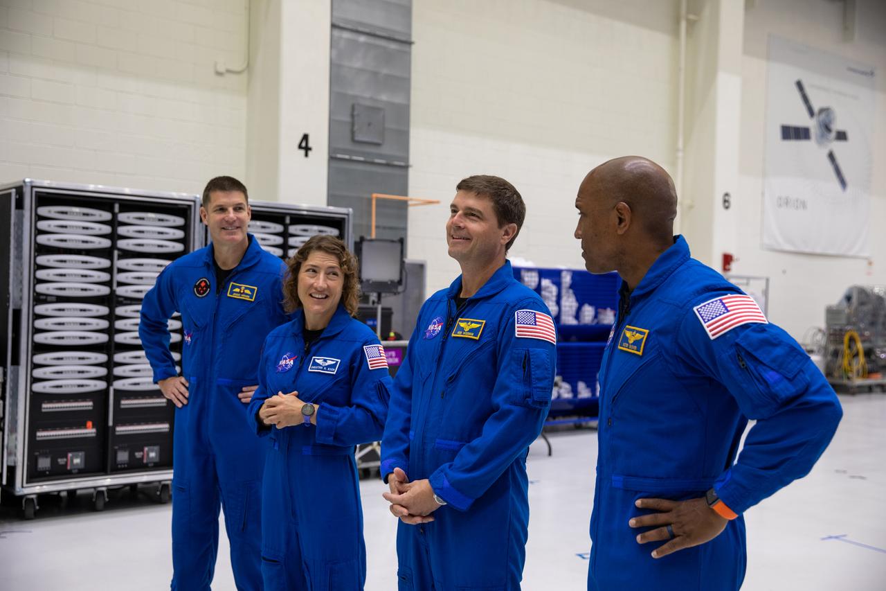 Artemis II crew members, shown inside the Neil Armstrong Operations and Checkout Building at NASA’s Kennedy Space Center in Florida, check out their Orion crew module on Aug. 8, 2023. From left are: Jeremy Hansen, mission specialist; Christina Hammock Koch, mission specialist; Reid Wiseman, commander; and Victor Glover, pilot. The crew module is undergoing acoustic testing ahead of integration with the European Service Module. Artemis II is the first crewed mission on NASA’s path to establishing a long-term lunar presence for science and exploration under Artemis.