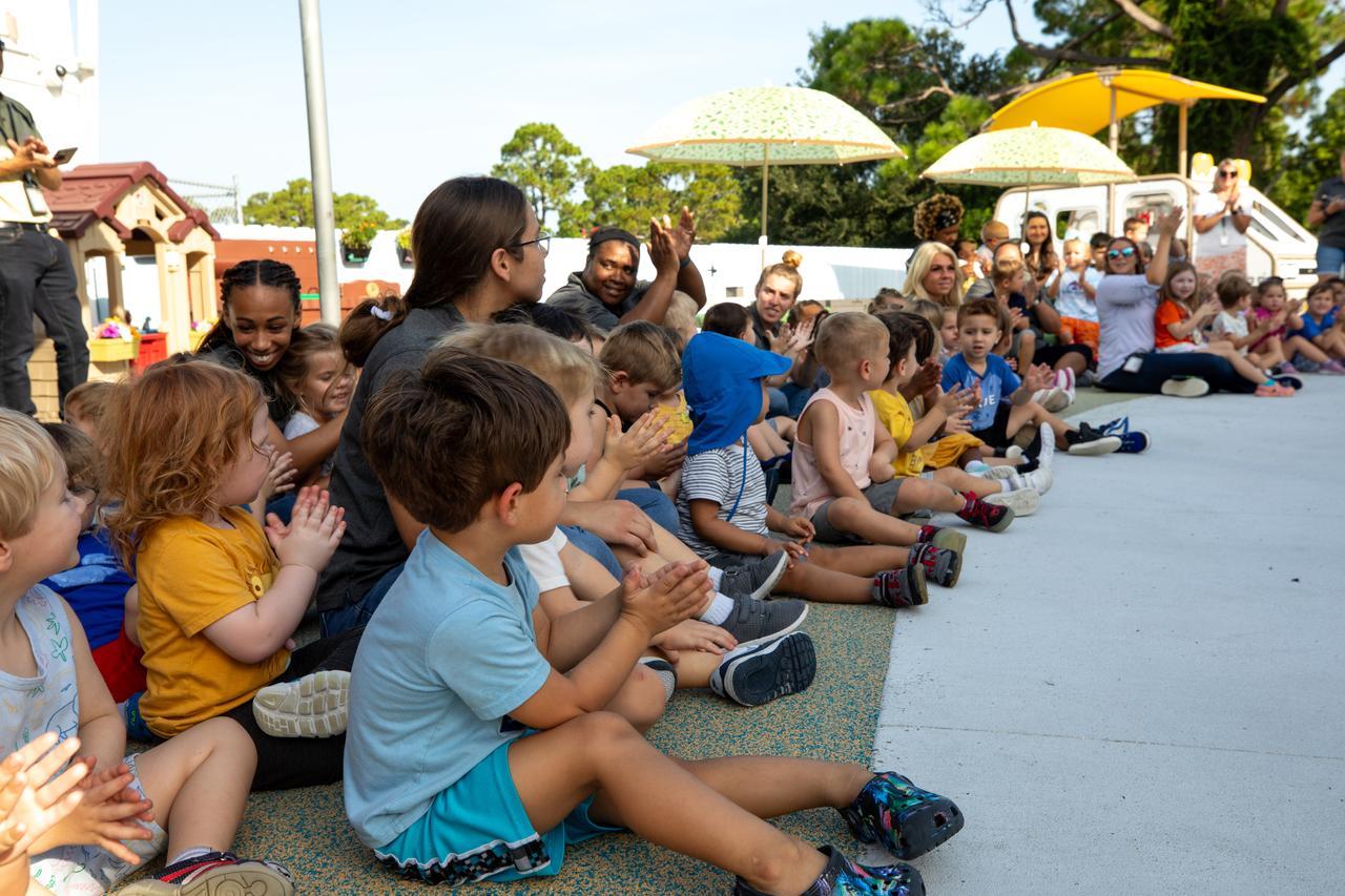 Children anxiously anticipate the opening of a new playground at Kennedy Space Center’s Child Development Center on Aug. 10, 2023. The kids were able to enjoy the playground immediately following a ribbon cutting ceremony.