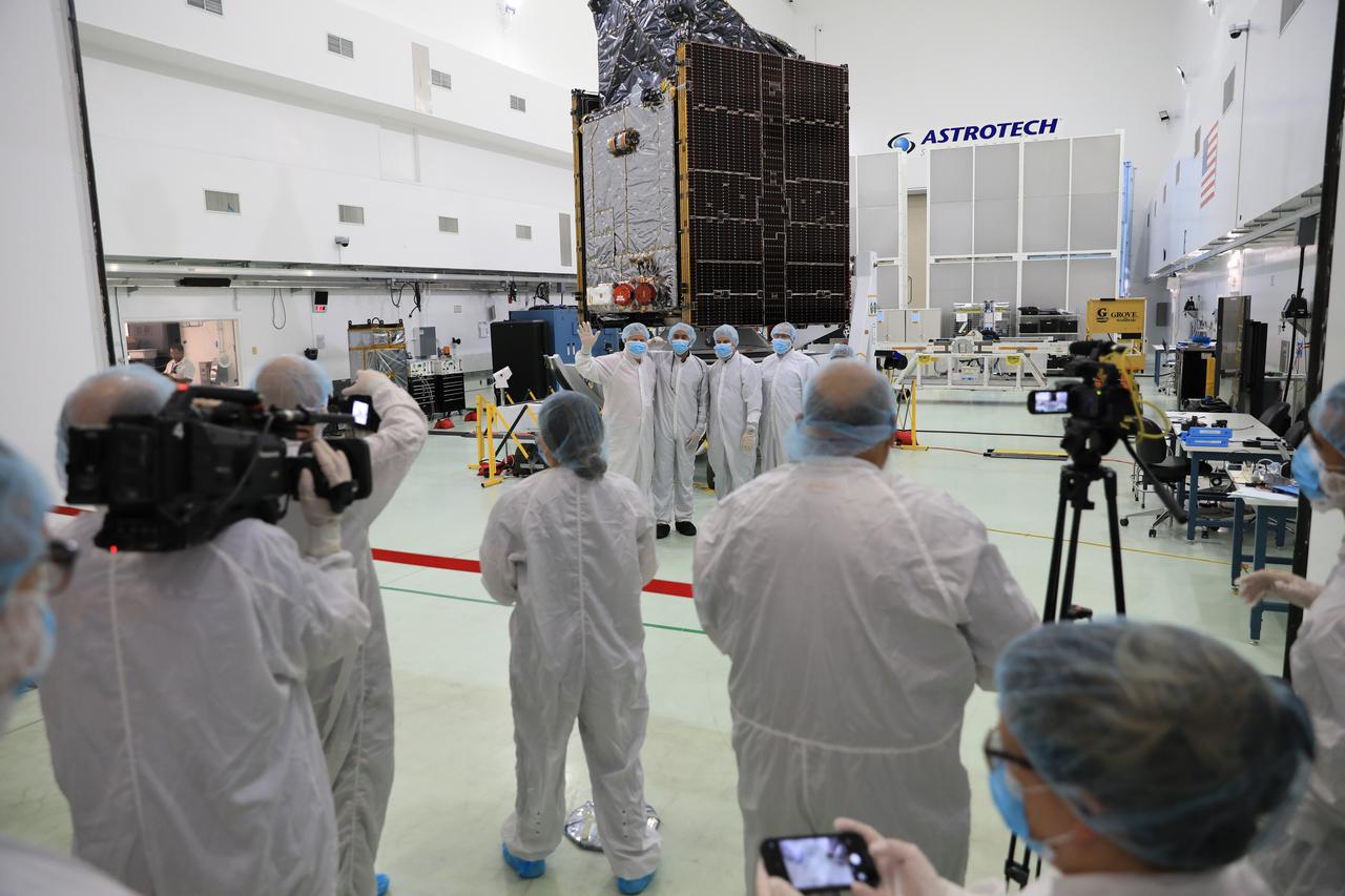 Members of NASA’s Psyche team are photographed with the spacecraft by media inside a cleanroom the Astrotech Space Operations Facility near Kennedy Space Center in Florida on Aug. 11, 2023. Psyche will launch atop a SpaceX Falcon Heavy rocket from Launch Complex 39A at Kennedy to explore a metal-rich asteroid. Launch is targeted for Oct. 5, 2023. Riding with Psyche is a pioneering technology demonstration, NASA’s Deep Space Optical Communications (DSOC) experiment.