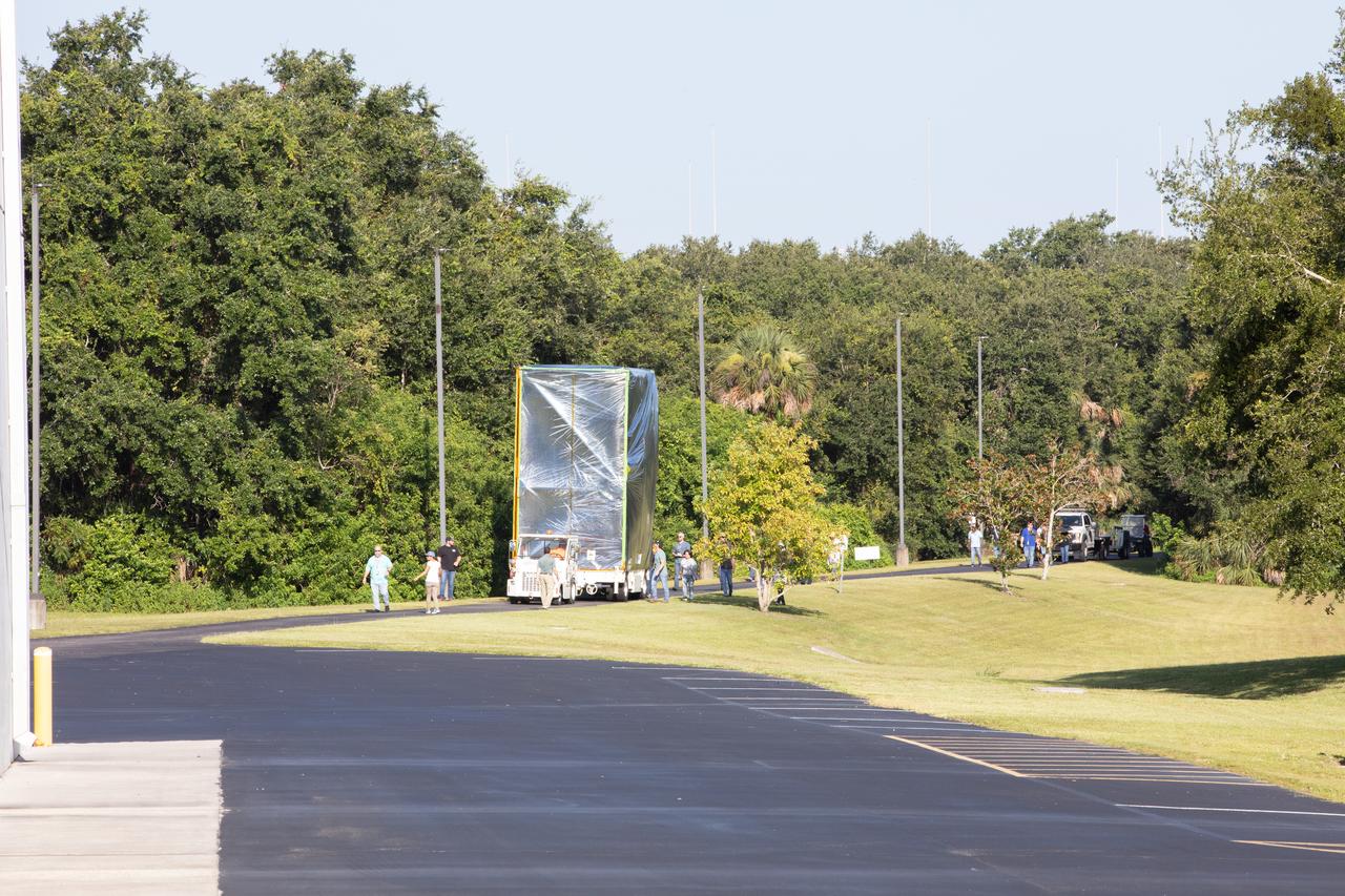 Technicians and engineers moved NASA’s Psyche spacecraft along the road to Building 9 at the Astrotech Space Operations Facility near the agency’s Kennedy Space Center in Florida on Aug. 14, 2023. Psyche will explore its namesake, a metal-rich asteroid orbiting the Sun between Mars and Jupiter. Psyche has NASA’s Deep Space Optical Communications (DSOC) technology demonstration onboard the spacecraft. DSOC will be the agency's first demonstration of optical communication beyond the Moon. Psyche will launch atop a SpaceX Falcon Heavy rocket from Launch Complex 39A at Kennedy. Launch is targeted for Oct. 5, 2023. 
