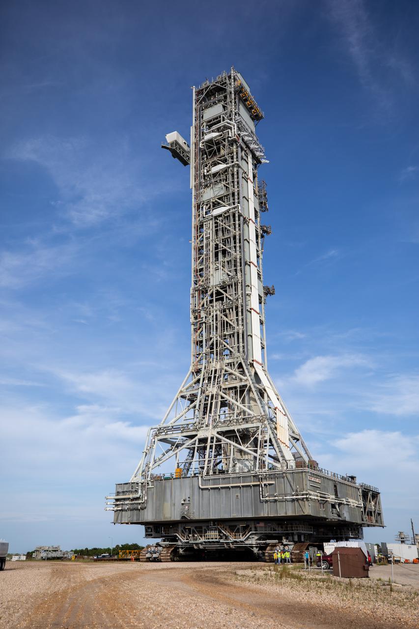 The mobile launcher, carried by the crawler-transporter 2, rolls out from its park site location to Launch Pad 39B at NASA’s Kennedy Space Center in Florida on Aug. 16, 2023. While at the pad, it will undergo testing for the agency’s Artemis II mission. Under Artemis, the mobile launcher will transport NASA’s Space Launch System rocket and Orion spacecraft to pad 39B for liftoff.