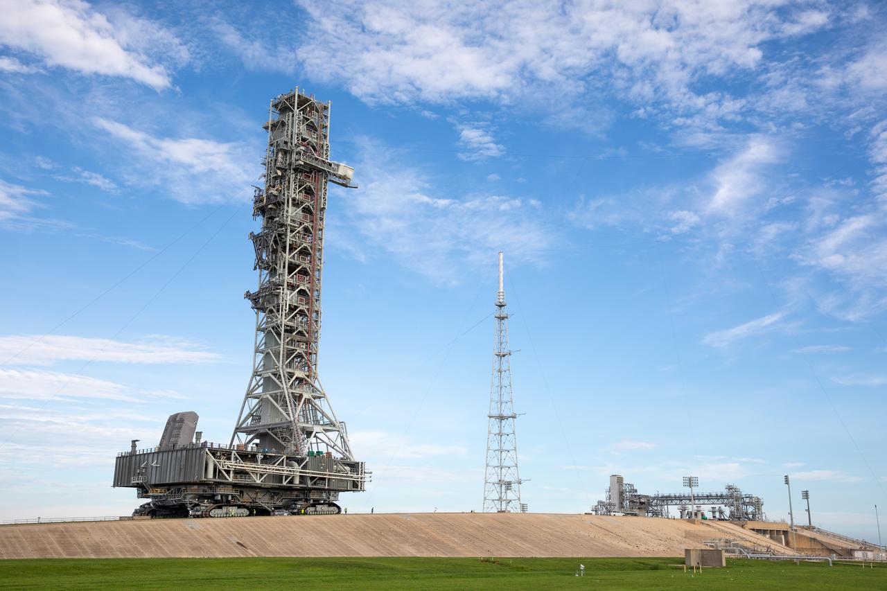 The mobile launcher, carried by the crawler-transporter 2, nears the pad at Launch Complex 39B at NASA’s Kennedy Space Center in Florida on Aug. 17, 2023. While at the pad, the mobile launcher will undergo testing for the agency’s Artemis II mission. Under Artemis, the mobile launcher will transport NASA’s Space Launch System rocket and Orion spacecraft to pad 39B for liftoff.