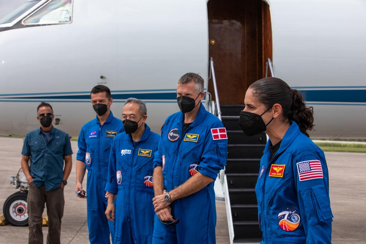 Crew members for NASA’s SpaceX Crew-7 mission to the International Space Station arrive at the Launch and Landing Facility at Kennedy Space Center in Florida on Sunday, Aug. 20, 2023. From left, Roscosmos cosmonaut Konstantin Borisov, JAXA (Japan Aerospace Exploration Agency) astronaut Satoshi Furukawa, ESA (European Space Agency) astronaut Andreas Mogensen, and NASA astronaut Jasmin Moghbeli speak with leaders from NASA, ESA, and JAXA.