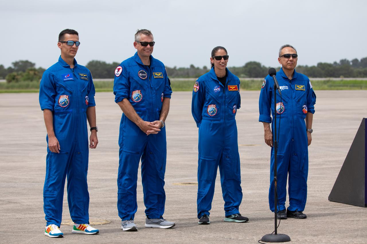 Crew members for NASA’s SpaceX Crew-7 mission to the International Space Station arrive at the Launch and Landing Facility at Kennedy Space Center in Florida on Sunday, Aug. 20, 2023. From left, Roscosmos cosmonaut Konstantin Borisov, ESA (European Space Agency) astronaut Andreas Mogensen, NASA astronaut Jasmin Moghbeli, and JAXA (Japan Aerospace Exploration Agency) astronaut Satoshi Furukawa stand before members of the news media. Liftoff of the Crew-7 mission is targeted for 3:49 a.m. EDT Friday, Aug. 25, 2023, from Kennedy’s Launch Complex 39A.