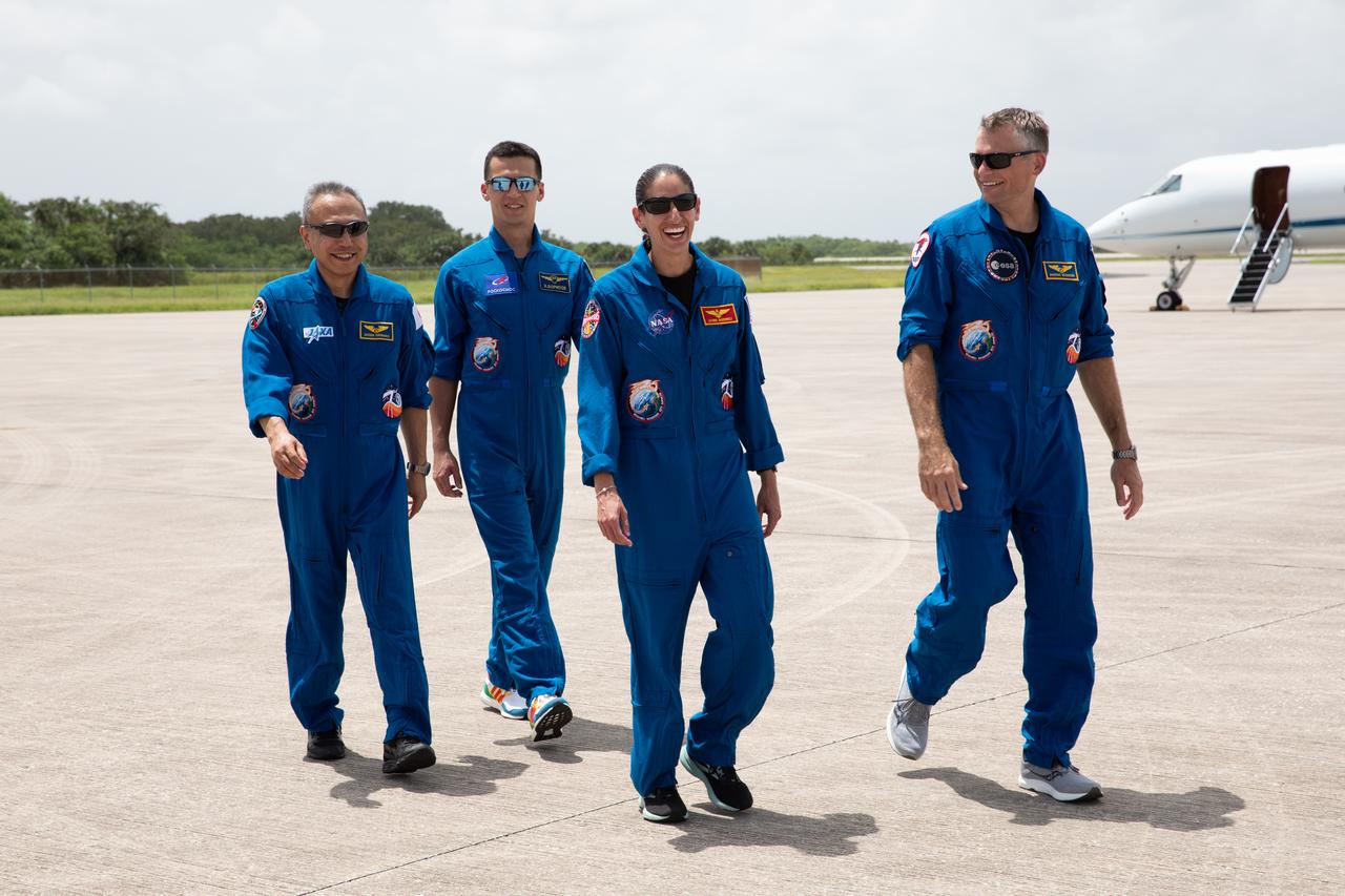 Crewmates for NASA’s SpaceX Crew-7 mission to the International Space Station walk along the runway at the Launch and Landing Facility at Kennedy Space Center in Florida on Sunday, Aug. 20, 2023. From left, JAXA (Japan Aerospace Exploration Agency) astronaut Satoshi Furukawa, Roscosmos cosmonaut Konstantin Borisov, NASA astronaut Jasmin Moghbeli, and ESA (European Space Agency) astronaut Andreas Mogensen will launch aboard a SpaceX Dragon spacecraft and Falcon 9 rocket at 3:49 a.m. EDT Friday, Aug. 25, 2023, from Kennedy’s Launch Complex 39A.