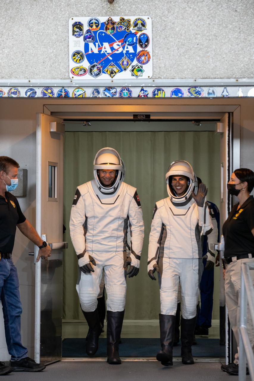 NASA’s SpaceX Crew-7 crew members walk out of the Neil A. Armstrong Operations and Checkout Building on Tuesday, Aug. 22, 2023, at the agency’s Kennedy Space Center in Florida. They were participating in a countdown dress rehearsal to prepare for the upcoming mission launch. From left are ESA (European Space Agency) astronaut Andreas Mogensen and NASA astronaut Jasmin Moghbeli. The crew, which also includes JAXA (Japan Aerospace Exploration Agency) astronaut Satoshi Furukawa and Roscosmos cosmonaut Konstantin Borisov, will launch to the International Space Station aboard SpaceX’s Dragon spacecraft on the company’s Falcon 9 rocket. Liftoff is targeted for 3:49 a.m. EDT Friday, Aug. 25, 2023, from Kennedy’s Launch Complex 39A.