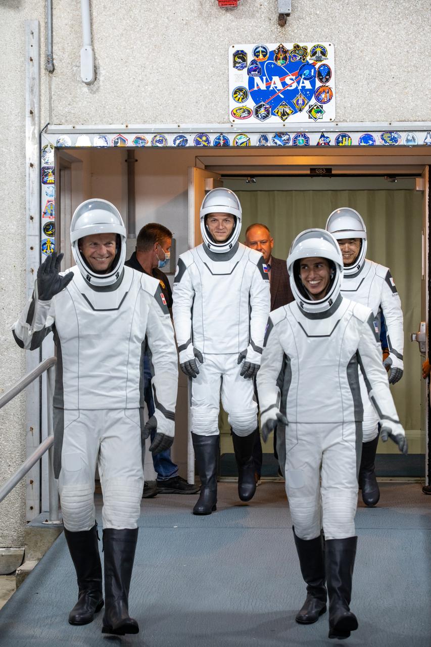 NASA’s SpaceX Crew-7 crew members walk out of the Neil A. Armstrong Operations and Checkout Building on Tuesday, Aug. 22, 2023, at the agency’s Kennedy Space Center in Florida. They were participating in a countdown dress rehearsal to prepare for the upcoming mission launch. From left (front to back) are ESA (European Space Agency) astronaut Andreas Mogensen, NASA astronaut Jasmin Moghbeli, Roscosmos cosmonaut Konstantin Borisov, and JAXA (Japan Aerospace Exploration Agency) astronaut Satoshi Furukawa. The crew will launch to the International Space Station aboard SpaceX’s Dragon spacecraft on the company’s Falcon 9 rocket. Liftoff is targeted for 3:49 a.m. EDT Friday, Aug. 25, 2023, from Kennedy’s Launch Complex 39A.
