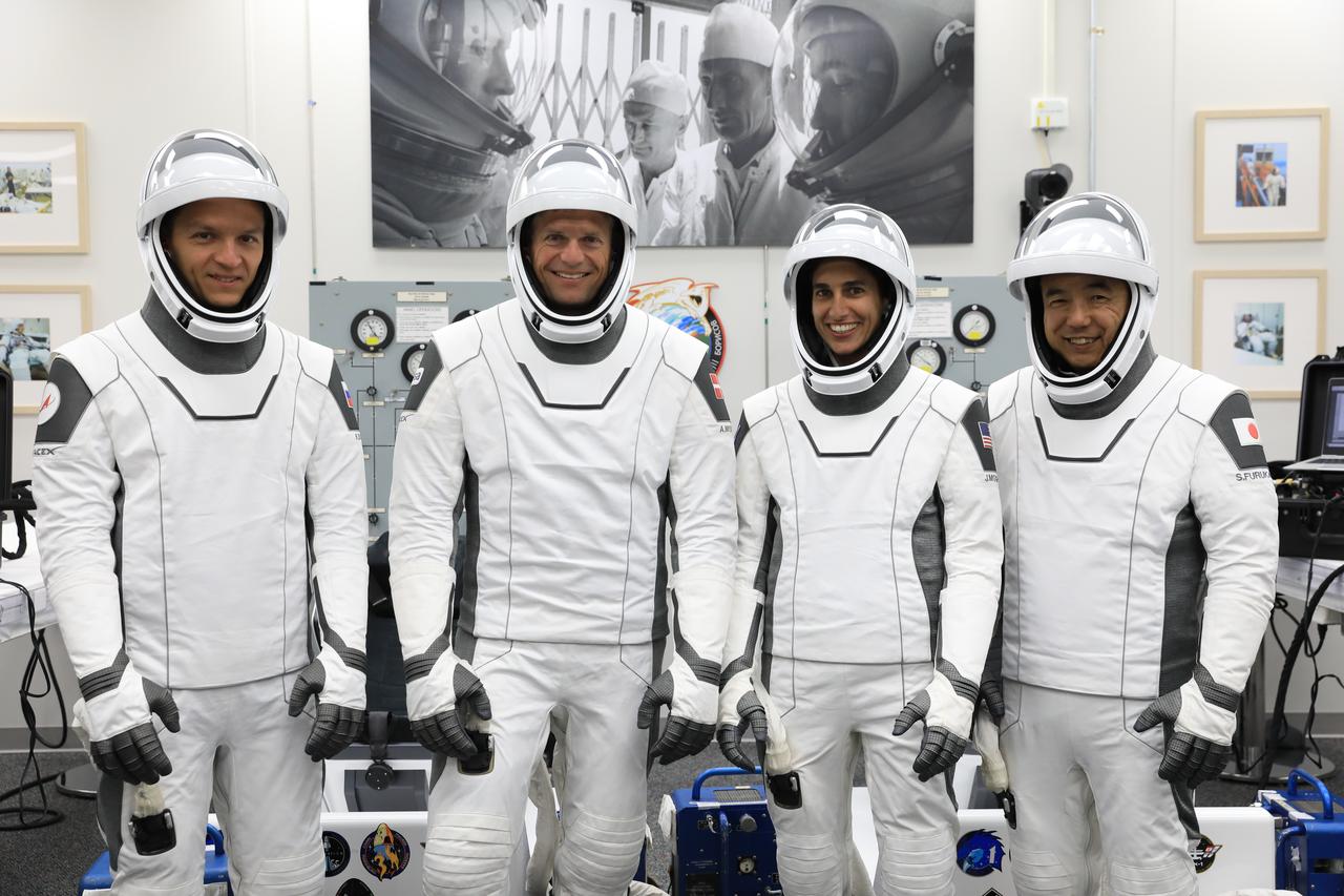 NASA’s SpaceX Crew-7 crew members participate in a countdown dress rehearsal at the agency’s Kennedy Space Center in Florida on Tuesday, Aug. 22, 2023, to prepare for the upcoming mission launch. In their SpaceX spacesuits inside the crew suit-up room in the Neil A. Armstrong Operations and Checkout Building are, from left, Roscosmos cosmonaut Konstantin Borisov, ESA (European Space Agency) astronaut Andreas Mogensen, NASA astronaut Jasmin Moghbeli, and JAXA (Japan Aerospace Exploration Agency) astronaut Satoshi Furukawa. The crew will launch to the International Space Station aboard the SpaceX’s Dragon spacecraft and Falcon 9 rocket. Liftoff is targeted for 3:49 a.m. EDT Friday, Aug. 25, 2023, from Kennedy’s Launch Complex 39A.
