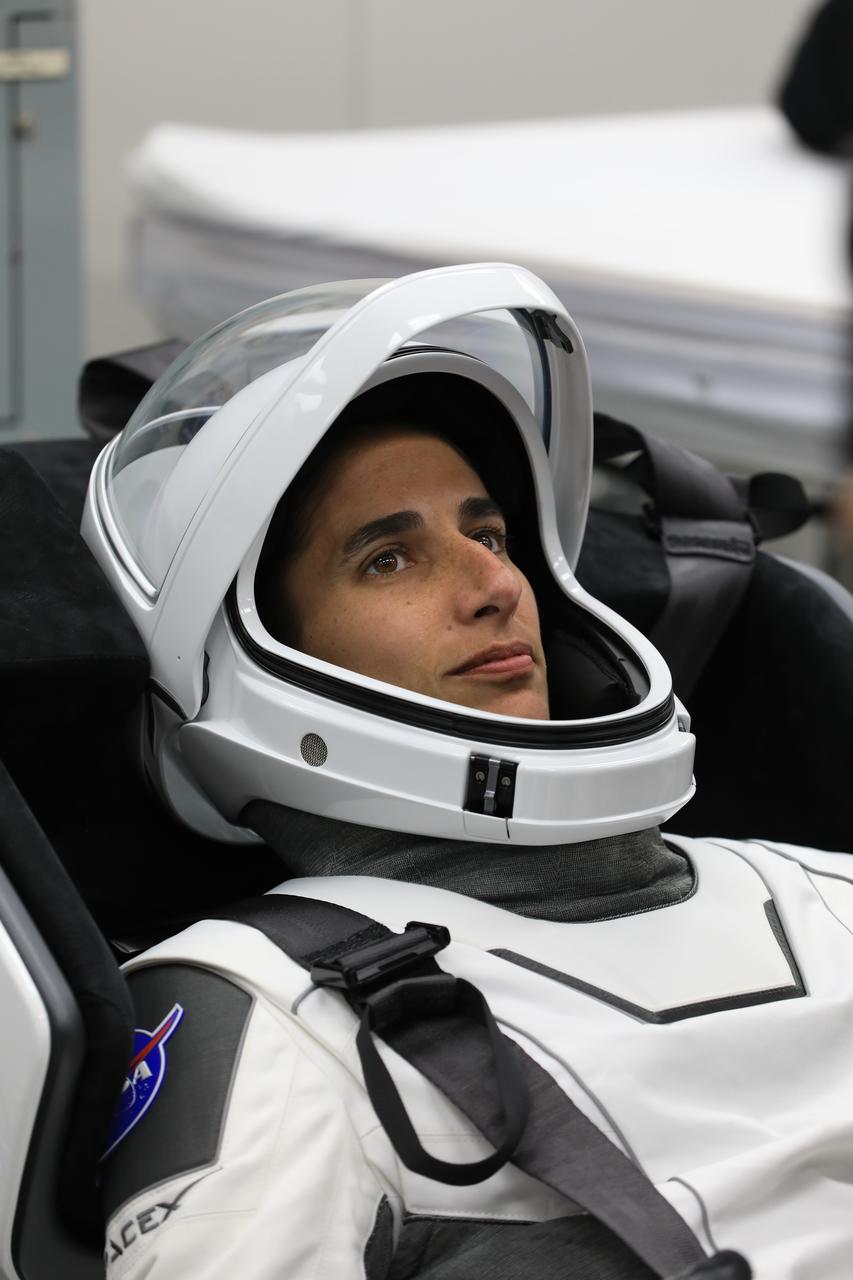NASA astronaut Jasmin Moghbeli is photographed on Tuesday, Aug. 22, 2023, in a SpaceX spacesuit inside the crew suit-up room in the Neil A. Armstrong Operations and Checkout Building at NASA’s Kennedy Space Center in Florida during a countdown dress rehearsal. The Crew-7 crew will launch to the International Space Station aboard SpaceX’s Dragon spacecraft and Falcon 9 rocket. Launch is targeted for 3:49 a.m. EDT Friday, Aug. 25, 2023, from Kennedy’s Launch Complex 39A. Crew-7 is the seventh crew rotation mission with SpaceX to the station, and the eighth flight of Dragon with people as part of the agency’s Commercial Crew Program.