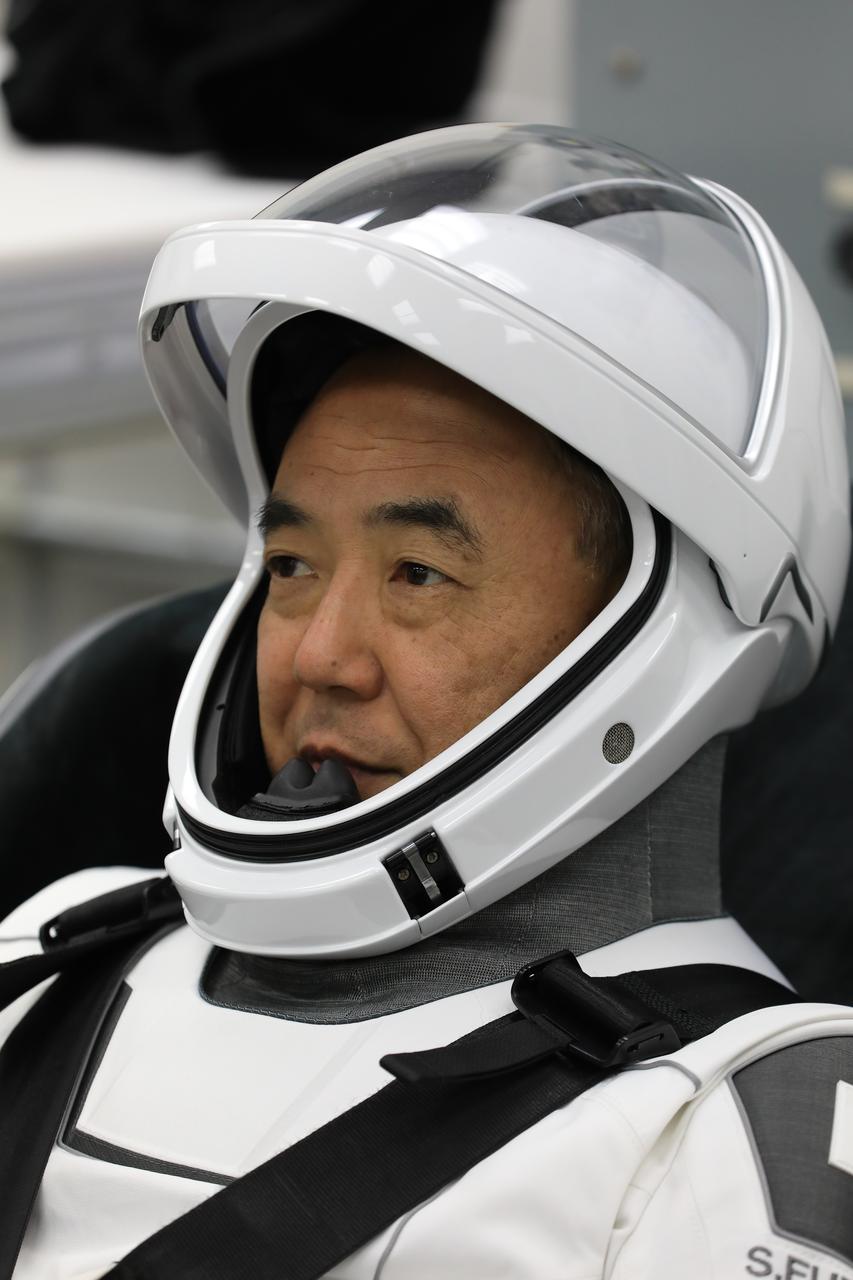 JAXA (Japan Aerospace Exploration Agency) astronaut Satoshi Furukawa is photographed on Tuesday, Aug. 22, 2023, in a SpaceX spacesuit inside the crew suit-up room in the Neil A. Armstrong Operations and Checkout Building at NASA’s Kennedy Space Center in Florida during a countdown dress rehearsal. The Crew-7 crew will launch to the International Space Station aboard SpaceX’s Dragon spacecraft and Falcon 9 rocket. Launch is targeted for 3:49 a.m. EDT Friday, Aug. 25, 2023, from Kennedy’s Launch Complex 39A. Crew-7 is the seventh crew rotation mission with SpaceX to the station, and the eighth flight of Dragon with people as part of the agency’s Commercial Crew Program.