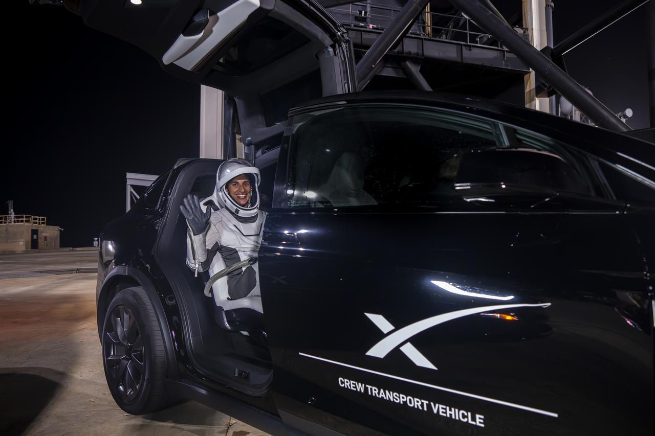 NASA astronaut Jasmin Moghbeli waves from inside a SpaceX crew transport vehicle at Kennedy Space Center in Florida on Tuesday, Aug. 22, 2023, as part of a countdown dress rehearsal for NASA’s SpaceX Crew-7 mission. Moghbeli, along with ESA (European Space Agency) astronaut Andreas Mogensen, JAXA (Japan Aerospace Exploration Agency) astronaut Satoshi Furukawa, and Roscosmos cosmonaut Konstantin Borisov, will fly to the International Space Station for a six-month rotation, conducting research and science experiments. Liftoff is targeted for 3:50 a.m. EDT Friday, Aug. 25, 2023.