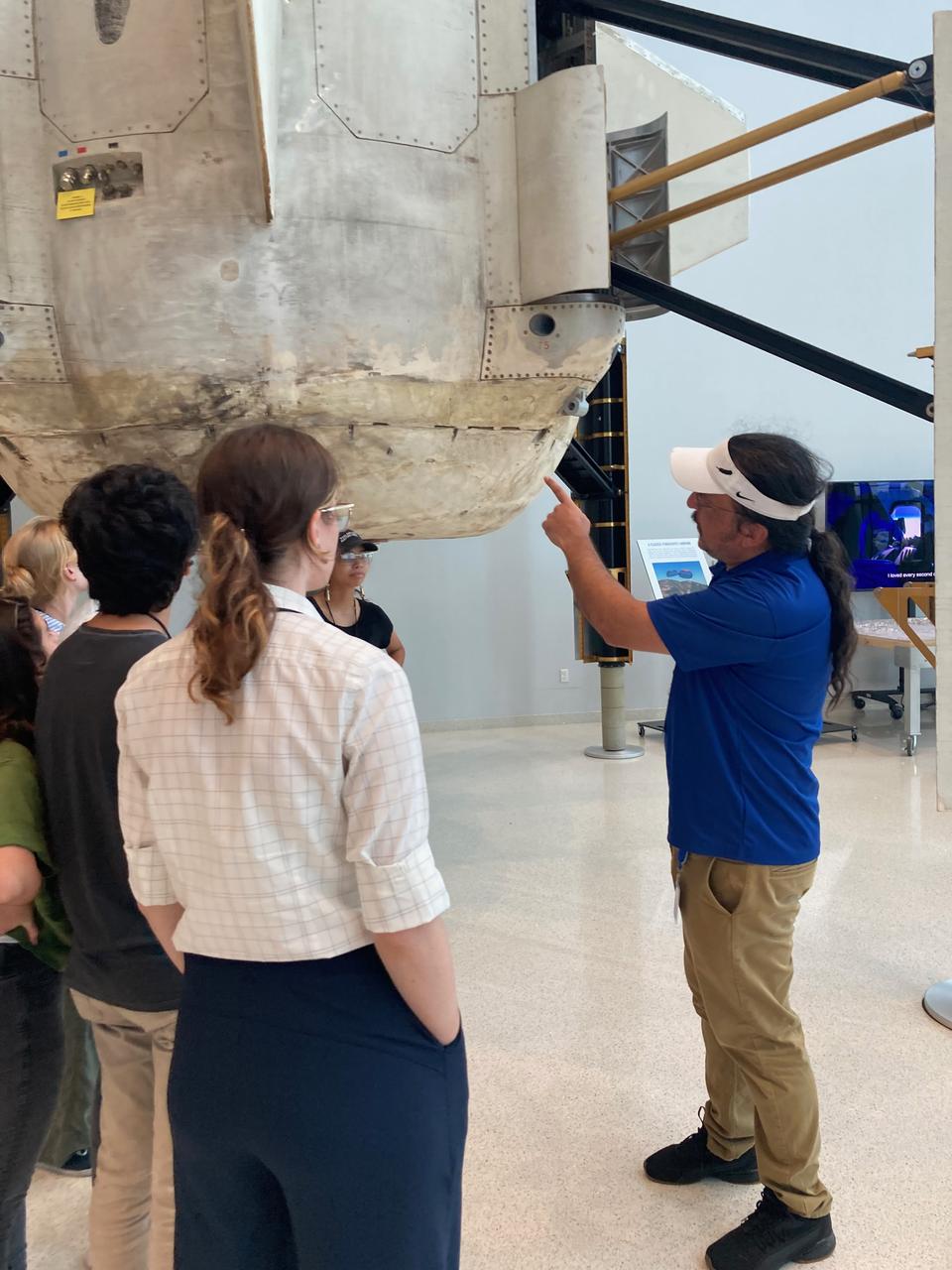   Participants from the 14th First Nations Launch High-Power Rocket Competition watch NASA’s SpaceX Crew-7 launch from the Banana Creek viewing site at the agency’s Kennedy Space Center in Florida on Saturday, Aug. 26, 2023. A SpaceX Falcon 9 rocket carrying NASA astronaut Jasmin Moghbeli, ESA (European Space Agency) astronaut Andreas Mogensen, JAXA (Japan Aerospace Exploration Agency) astronaut Satoshi Furukawa, and Roscosmos cosmonaut Konstantin Borisov launched to the International Space Station at 3:27 a.m. EDT from Kennedy’s Launch Complex 39A. Students and advisors from University of Washington, University of Colorado-Boulder, and an international team from Queens University – this year’s First Nations Launch grand prize teams – traveled to Kennedy for a VIP tour, culminating in viewing the Crew-7 launch. Another highlight included a guided tour of historic Hangar AE, led by James Wood (Osage Nation and Loyal Shawnee), chief engineer of NASA’s Launch Services Program, technical advisor for the Crew-7 launch, and First Nations mentor and judge. One of NASA’s Artemis Student Challenges, the First Nations Launch competition comprises students from tribal colleges and universities, Native American-Serving Nontribal Institutions, and collegiate chapters of the American Indian Science and Engineering Society who design, build, and launch a high-powered rocket from a launch site in Kansasville, Wisconsin. The competition is facilitated by NASA’s Wisconsin Space Grant Consortium and managed by the agency’s Office of STEM Engagement at Kennedy.