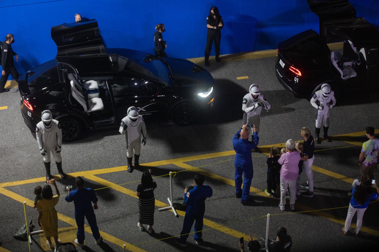 NASA’s SpaceX Crew-7 crew members Jasmin Moghbeli, Andreas Mogensen, Satoshi Furukawa, and Konstantin Borisov wave to their families and friends on Saturday, Aug. 26, 2023, outside of the Neil Armstrong Operations and Checkout Building at NASA’s Kennedy Space Center in Florida. Next, they will get into the customized Tesla Model X vehicles that will transport them to Kennedy’s Launch Complex 39A. SpaceX’s Dragon spacecraft, powered by the company’s Falcon 9 rocket, will carry the four-person crew to the International Space Station as part of NASA’s Commercial Crew Program. Crew-7 is scheduled to launch at 3:27 a.m. EDT.