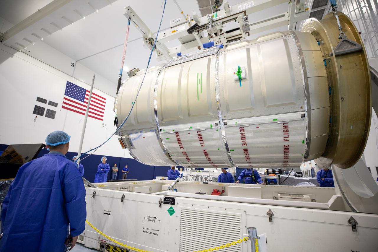 The Northrop Grumman Cygnus spacecraft’s pressurized cargo module (PCM) for the company’s 20th commercial resupply mission is lifted and moved by crane inside the high bay in the Space Station Processing Facility at NASA’s Kennedy Space Center in Florida on Monday, Sept. 18, 2023. The next step is vehicle processing for the mission to the International Space Station. Liftoff, aboard a SpaceX Falcon 9 rocket, will be from Cape Canaveral Space Force Station’s Space Launch Complex 40.