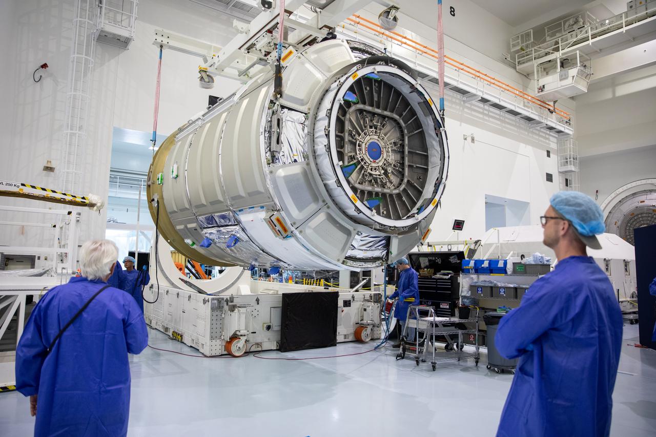 The Northrop Grumman Cygnus spacecraft’s pressurized cargo module (PCM) for the company’s 20th commercial resupply mission is lifted and moved by crane inside the high bay in the Space Station Processing Facility at NASA’s Kennedy Space Center in Florida on Monday, Sept. 18, 2023. The next step is vehicle processing for the mission to the International Space Station. Liftoff, aboard a SpaceX Falcon 9 rocket, will be from Cape Canaveral Space Force Station’s Space Launch Complex 40.