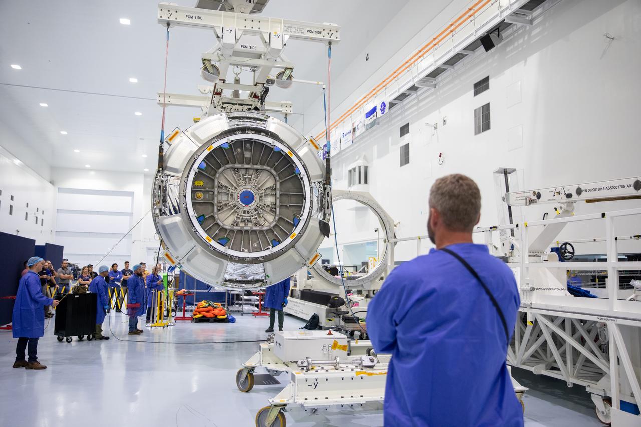 The Northrop Grumman Cygnus spacecraft’s pressurized cargo module (PCM) for the company’s 20th commercial resupply mission is lifted and moved by crane inside the high bay in the Space Station Processing Facility at NASA’s Kennedy Space Center in Florida on Monday, Sept. 18, 2023. The next step is vehicle processing for the mission to the International Space Station. Liftoff, aboard a SpaceX Falcon 9 rocket, will be from Cape Canaveral Space Force Station’s Space Launch Complex 40.