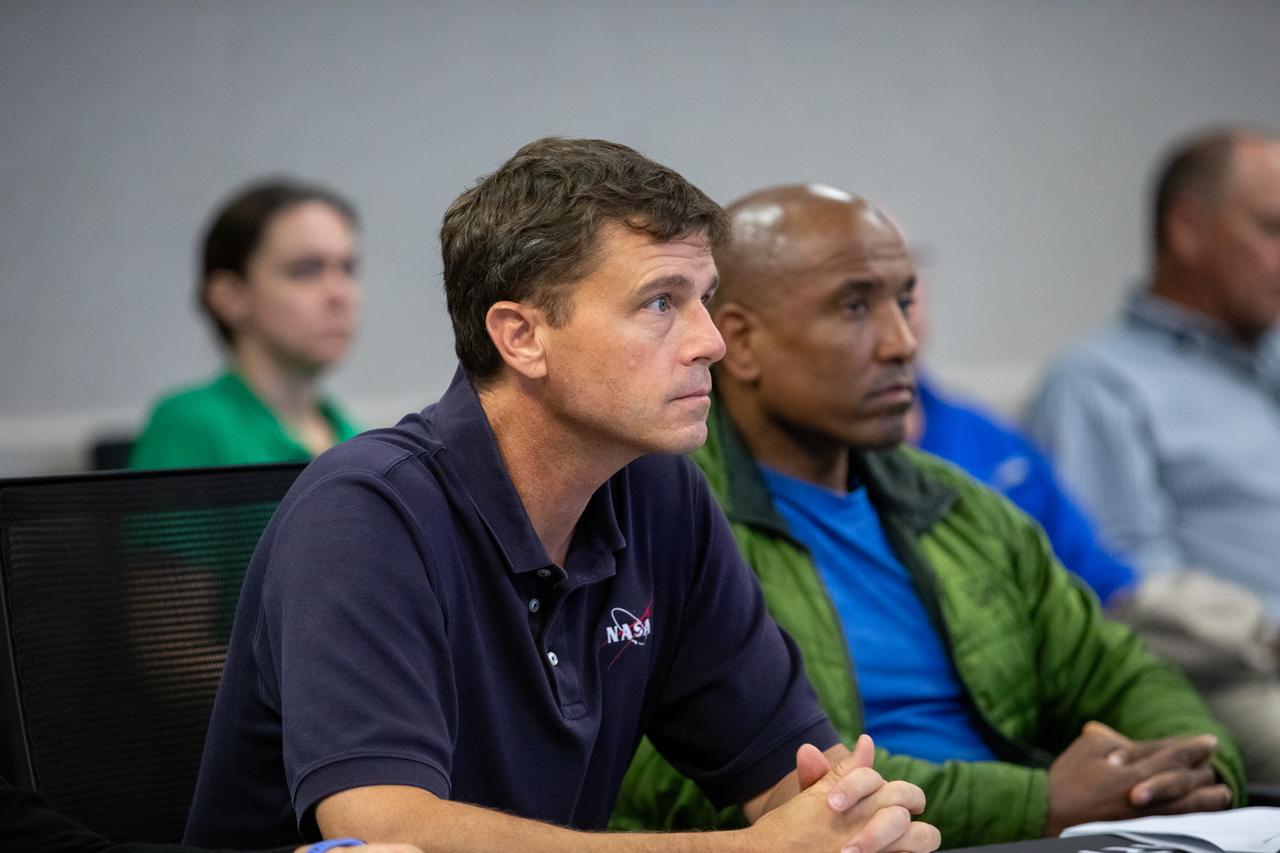 NASA astronauts Reid Wiseman (left) and Victor Glover (right) participate in an Artemis II pre-task briefing on Tuesday, Sept. 19, 2023, held in the Rocco A. Petrone Launch Control Center at NASA’s Kennedy Space Center in Florida. The briefing allows teams to collaborate ahead of a series of integrated system verification and validation tests conducted at Kennedy to evaluate the readiness of the crew and ground equipment ahead of launch day.