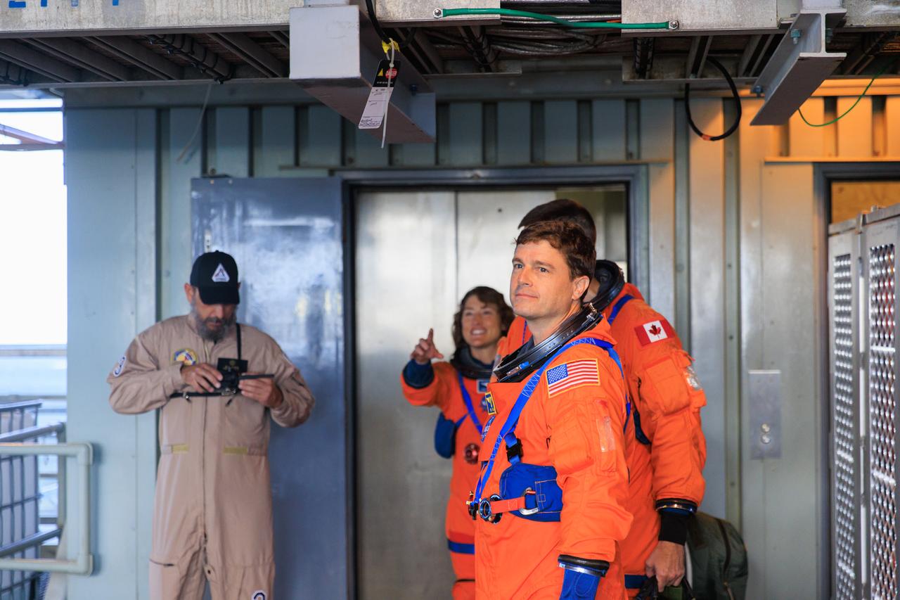 Artemis II NASA astronauts Reid Wiseman, Victor Glover, and Christina Koch, and CSA (Canadian Space Agency) astronaut Jeremy Hansen arrive to Launch Pad 39B and prepare to enter the mobile launcher and proceed to the crew access arm as part of an integrated ground systems test at Kennedy Space Center in Florida on Wednesday, Sept. 20, to test the crew timeline for launch day.