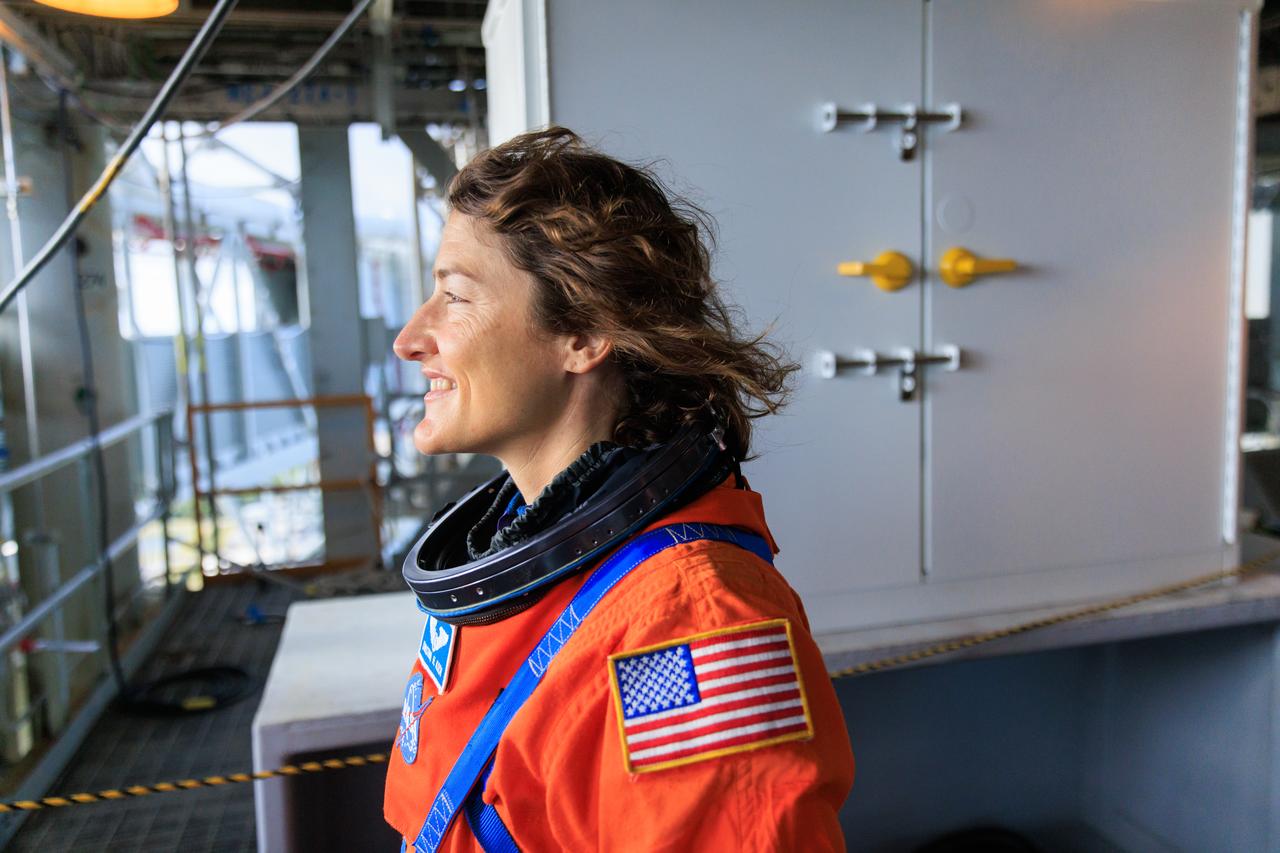 Artemis II NASA astronaut Christina Koch stands on the mobile launcher at Launch Pad 39B as part of an integrated ground systems test at Kennedy Space Center in Florida on Wednesday, Sept. 20, to test the crew timeline for launch day.