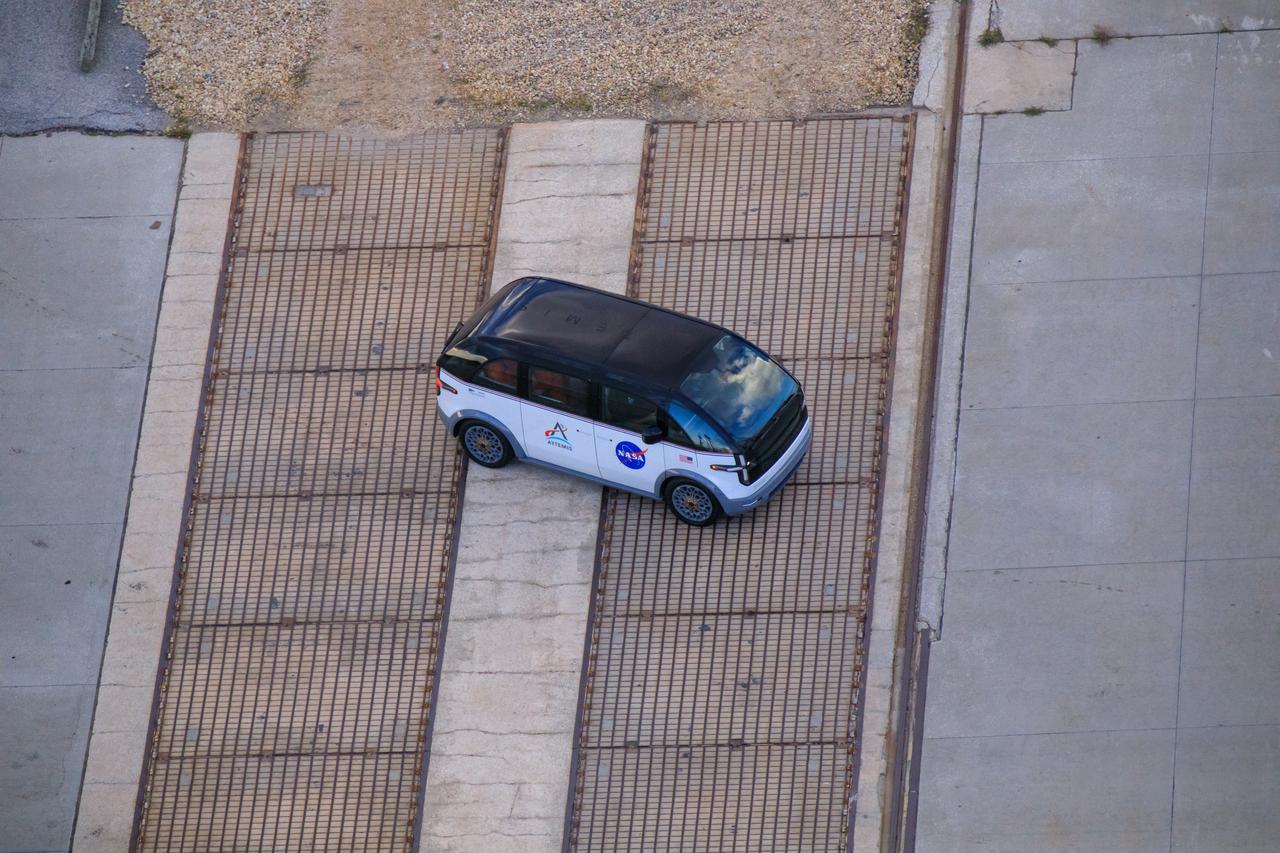 Artemis II NASA astronauts Reid Wiseman, Victor Glover, and Christina Koch, and CSA (Canadian Space Agency) astronaut Jeremy Hansen ride from Astronaut Crew Quarters in the Neil Armstrong Operations and Checkout Building to Launch Pad 39B in the Artemis crew transportation vehicles as part of an integrated ground systems test at Kennedy Space Center in Florida on Wednesday, Sept. 20, to test the crew timeline for launch day.