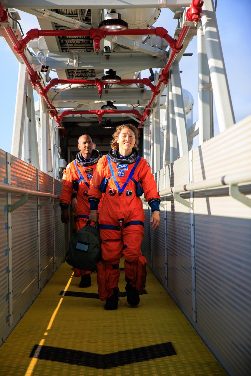 Artemis II NASA astronauts Reid Wiseman, Victor Glover, and Christina Koch, and CSA (Canadian Space Agency) astronaut Jeremy Hansen walk down the crew access arm of the mobile launcher at Launch Pad 39B as part of an integrated ground systems test at Kennedy Space Center in Florida on Wednesday, Sept. 20, 2023. The test ensures the ground systems team is ready to support the crew timeline on launch day.