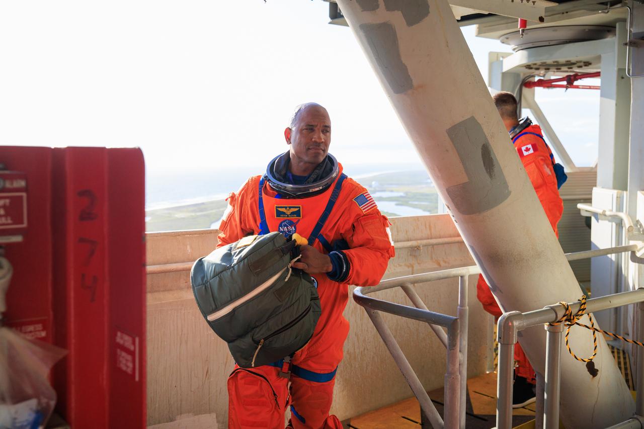 Artemis II NASA astronaut Victor Glover stands on the crew access arm of the mobile launcher at Launch Pad 39B as part of an integrated ground systems test at Kennedy Space Center in Florida on Wednesday, Sept. 20, 2023. The test ensures the ground systems team is ready to support the crew timeline on launch day.