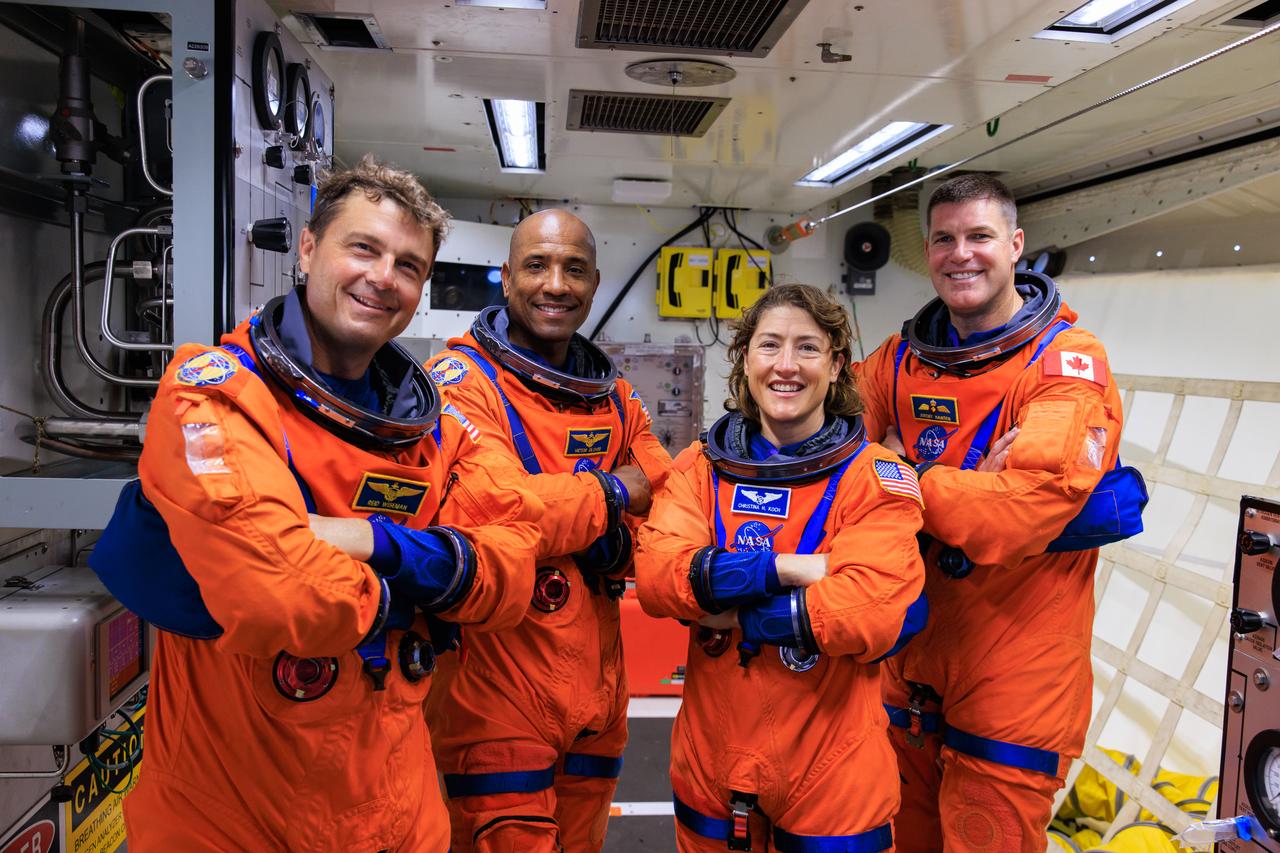 Artemis II NASA astronauts (left to right) Reid Wiseman, Victor Glover, and Christina Koch, and CSA (Canadian Space Agency) astronaut Jeremy Hansen stand in the white room on the crew access arm of the mobile launcher at Launch Pad 39B as part of an integrated ground systems test at Kennedy Space Center in Florida on Wednesday, Sept. 20, 2023. The test ensures the ground systems team is ready to support the crew timeline on launch day.