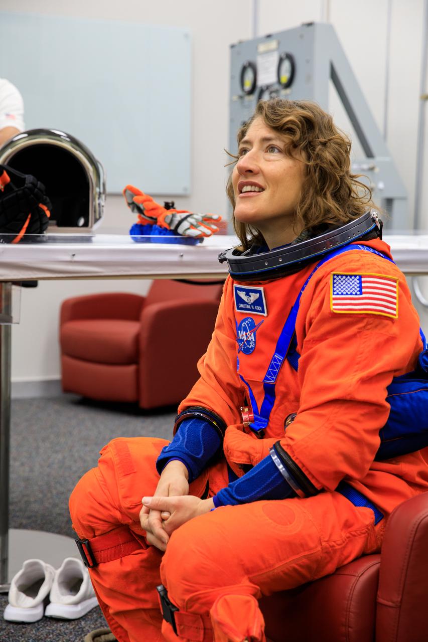 Inside the Astronaut Crew Quarters at the Neil Armstrong Operations and Checkout Building at NASA’s Kennedy Space Center in Florida, Artemis II crew member NASA astronaut Christina Koch is shown wearing a test version of the Orion crew survival system spacesuits the crew will wear on launch day as part of an integrated ground systems test on Wednesday, Sept. 20.