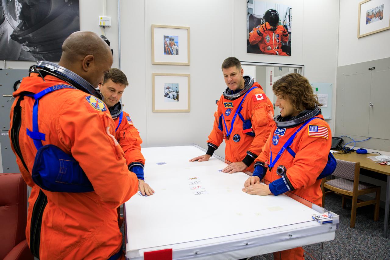 Inside the Astronaut Crew Quarters at the Neil Armstrong Operations and Checkout Building at NASA’s Kennedy Space Center in Florida, Artemis II crew members (from left) NASA astronauts Victor Glover, Reid Wiseman, CSA (Canadian Space Agency) astronaut Jeremy Hansen, and NASA astronaut Christina Koch are shown wearing test versions of the Orion crew survival system spacesuits they will wear on launch day as part of an integrated ground systems test on Wednesday, Sept. 20. 