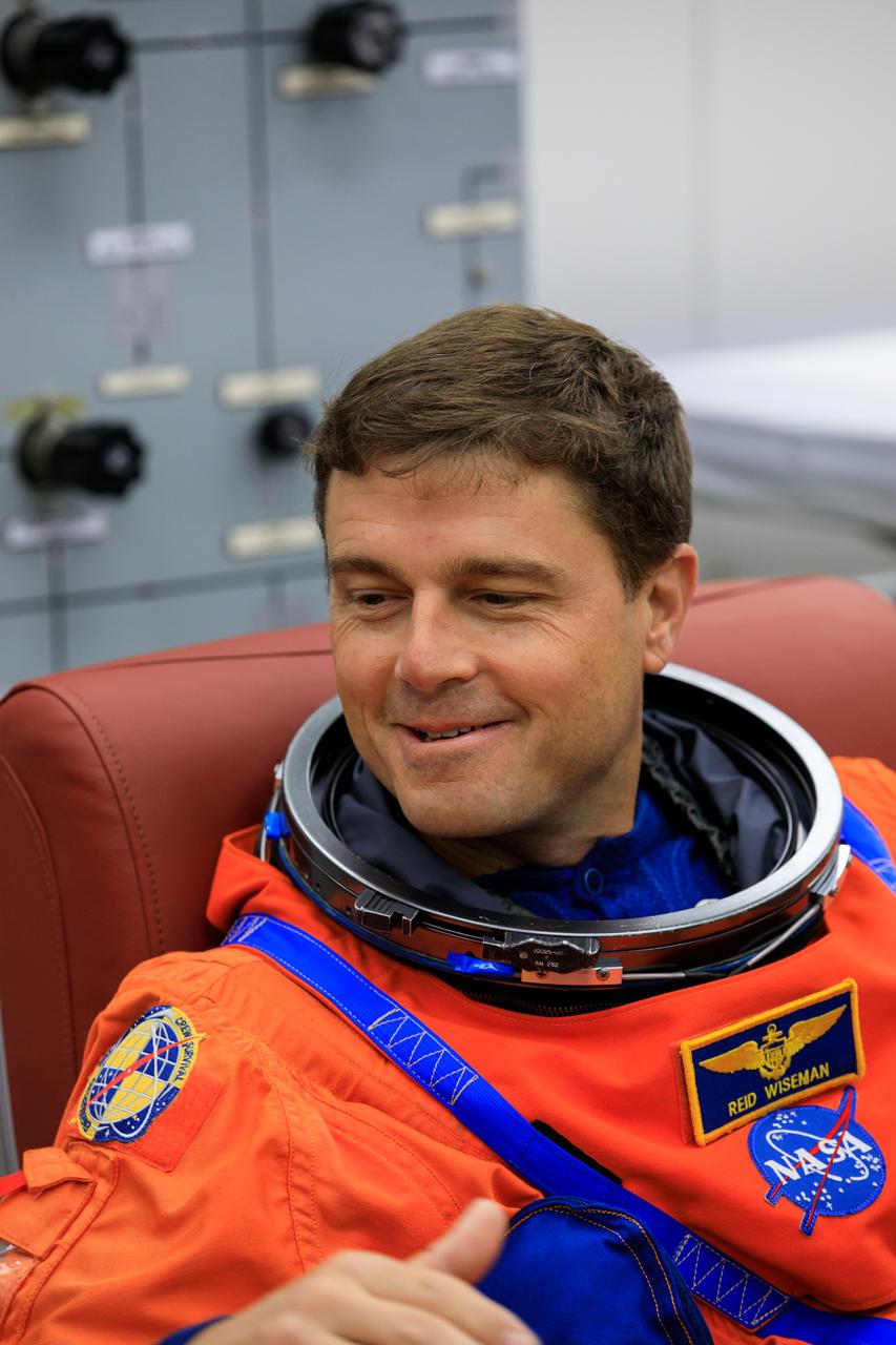 Inside the Astronaut Crew Quarters at the Neil Armstrong Operations and Checkout Building at NASA’s Kennedy Space Center in Florida, Artemis II crew member NASA astronaut Reid Wiseman is shown wearing a test version of the Orion crew survival system spacesuits the crew will wear on launch day as part of an integrated ground systems test on Wednesday, Sept. 20.